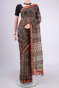 Beige Chanderi Silk Cotton Saree with Ajrakh Print on the body and Zari Border.  displayed on a mannequin