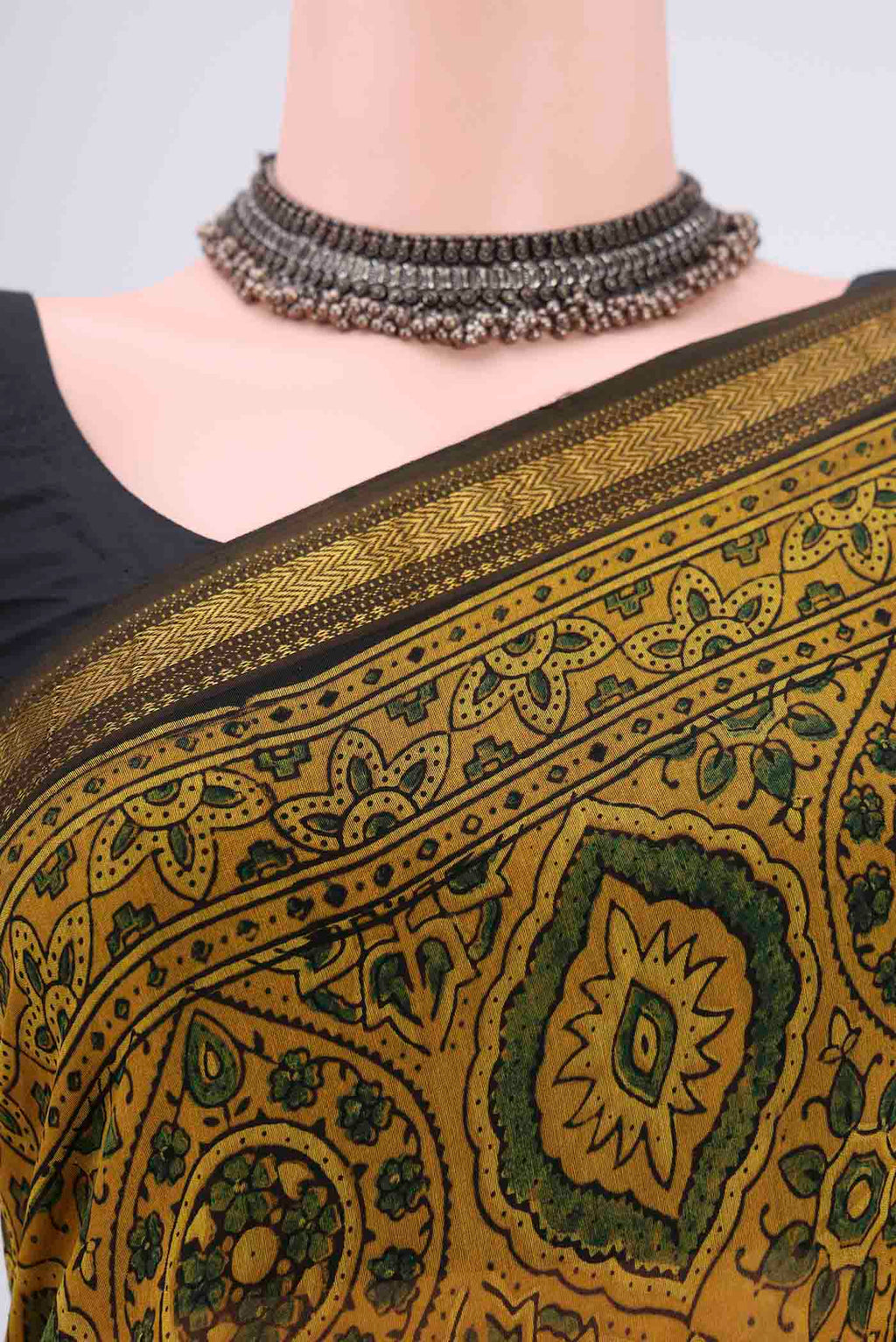 Border image of Yellow Chanderi Silk Cotton Saree with Ajrakh Print on the body and Zari Border. 
