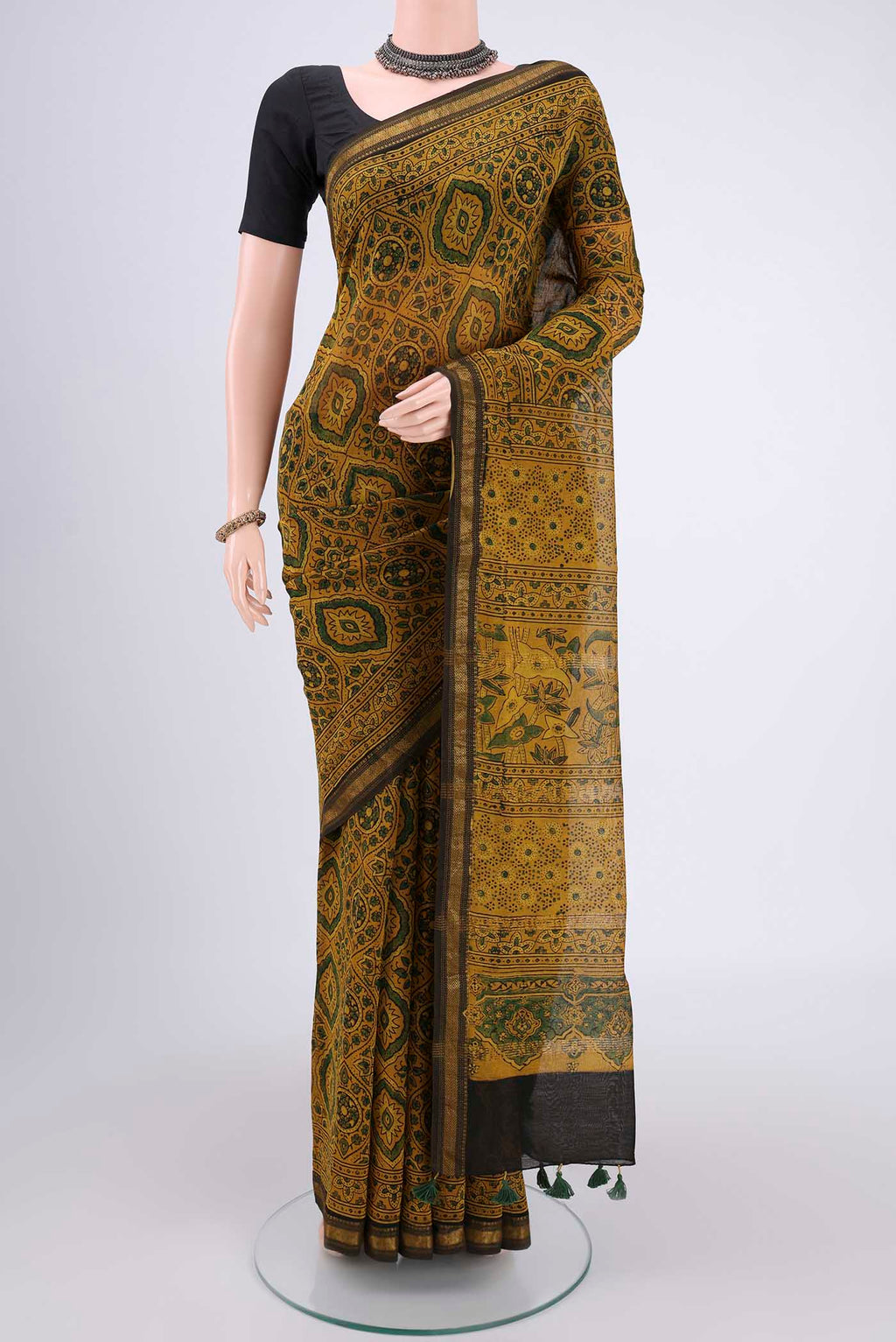 Yellow Chanderi Silk Cotton Saree with Ajrakh Print on the body and Zari Border.  displayed on a mannequin