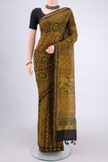 Yellow Chanderi Silk Cotton Saree with Ajrakh Print on the body and Zari Border.  displayed on a mannequin
