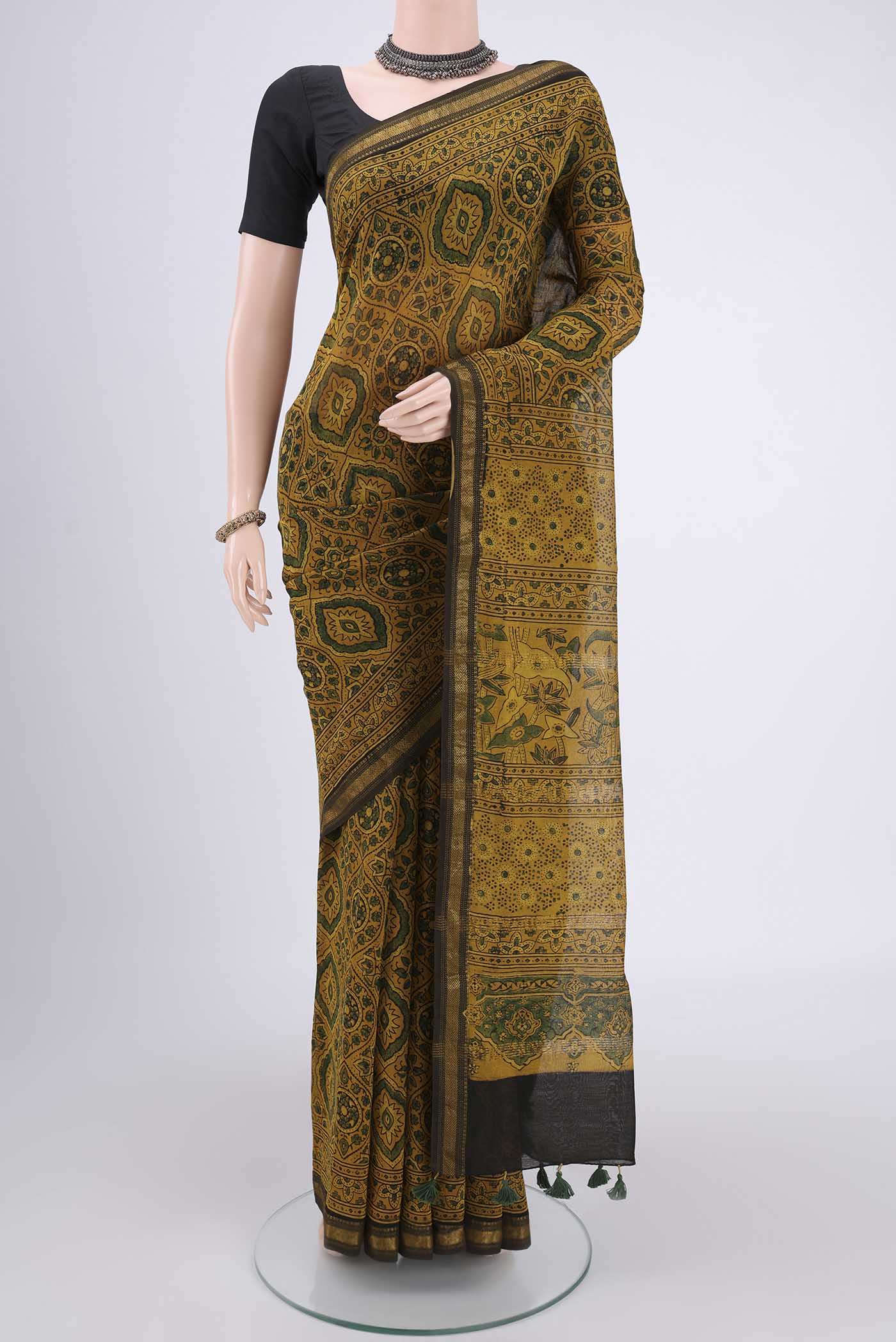 Yellow Chanderi Silk Cotton Saree with Ajrakh Print on the body and Zari Border.  displayed on a mannequin