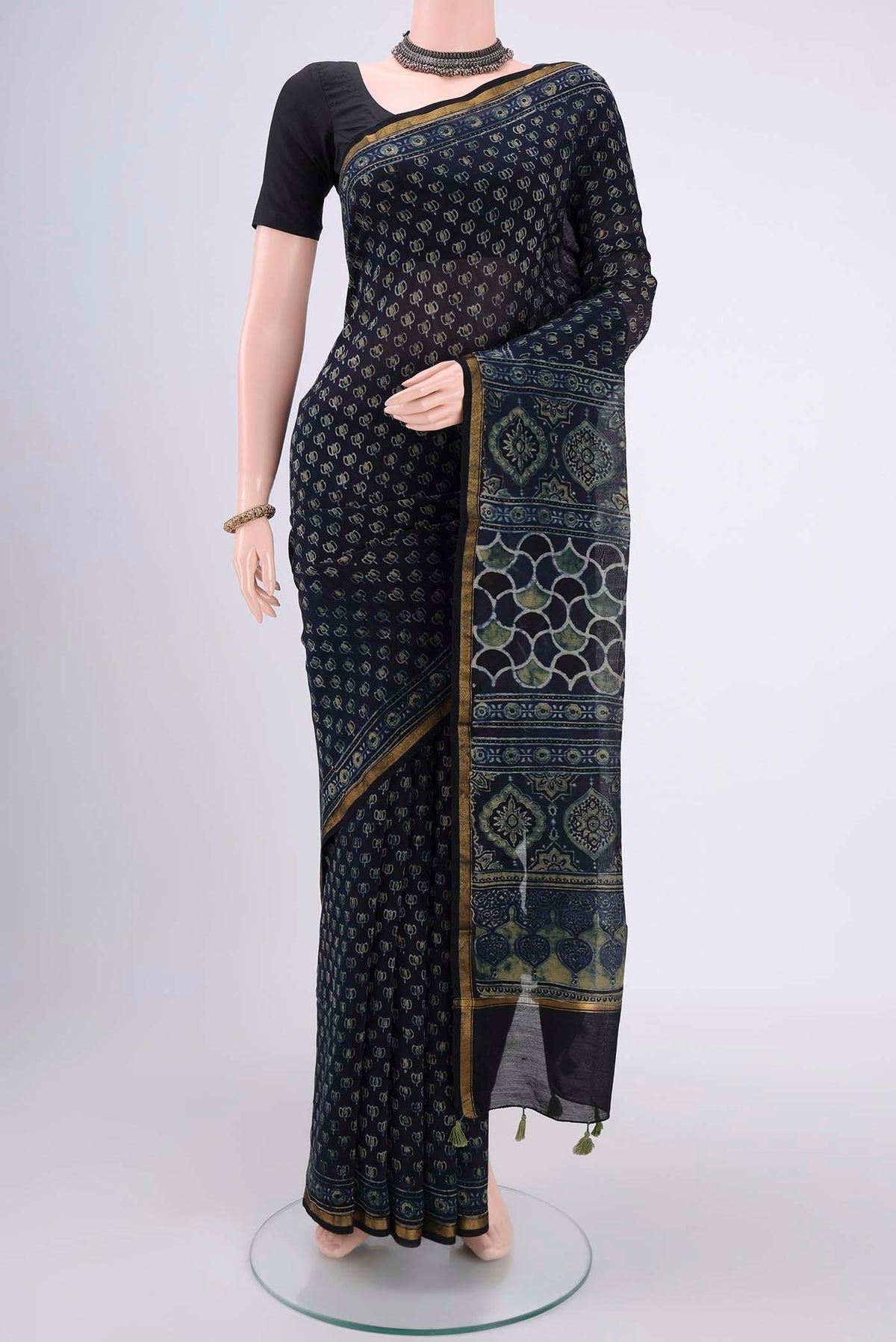 Navy Blue Chanderi Silk Cotton Saree with Ajrakh Print on the body and Zari Border.  displayed on a mannequin