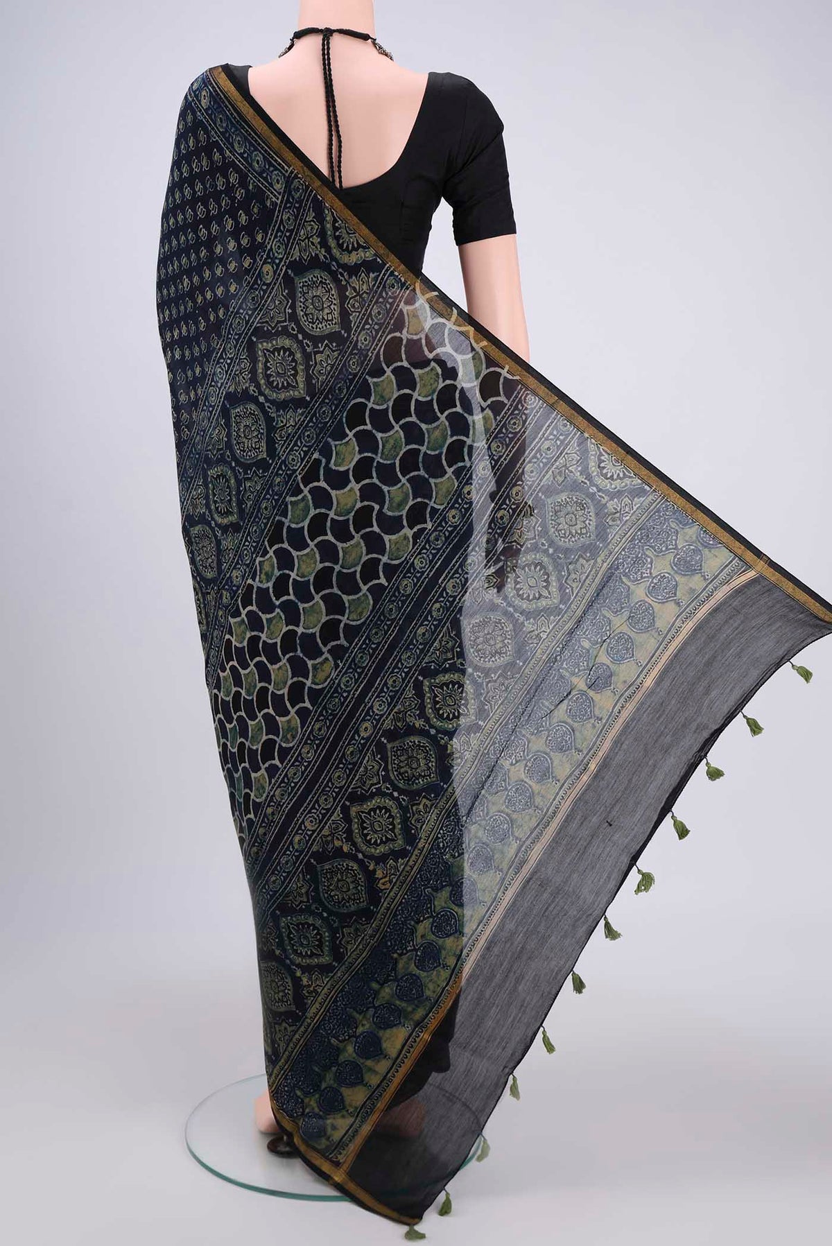 Flat view of Navy Blue Chanderi Silk Cotton Saree with Ajrakh Print on the body and Zari Border. 