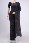 Navy Blue Chanderi Silk Cotton Saree with Ajrakh Print on the body and Zari Border.  displayed on a mannequin