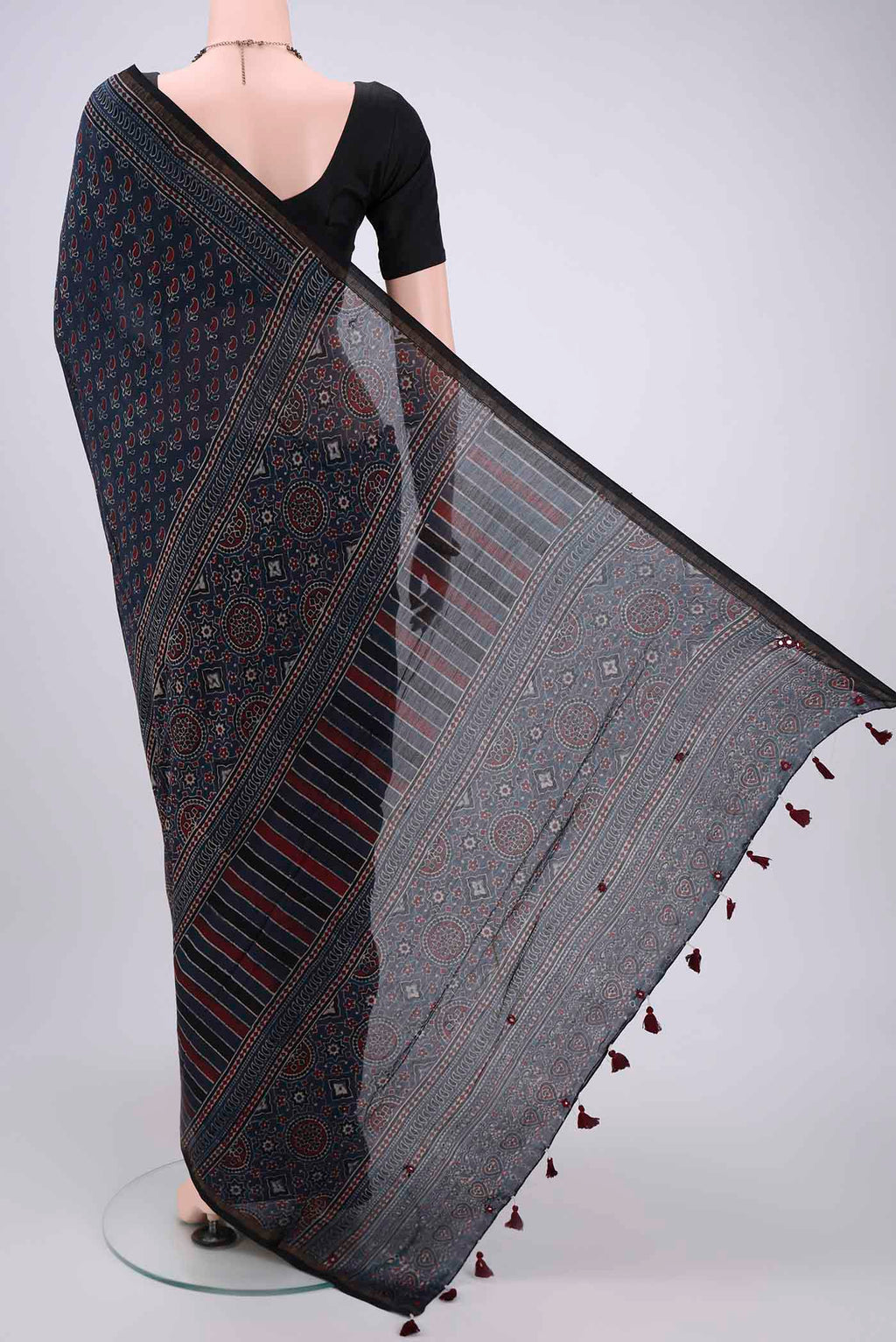 Flat view of Navy Blue Chanderi Silk Cotton Saree with Ajrakh Print on the body and Zari Border. 