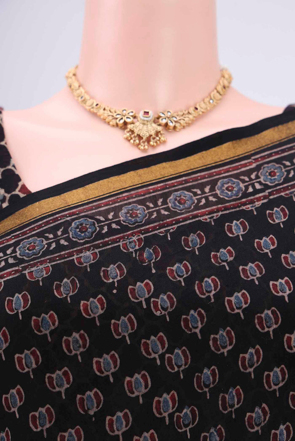 Border image of Black Chanderi Silk Cotton Saree with Ajrakh Print on the body and Zari Border. 