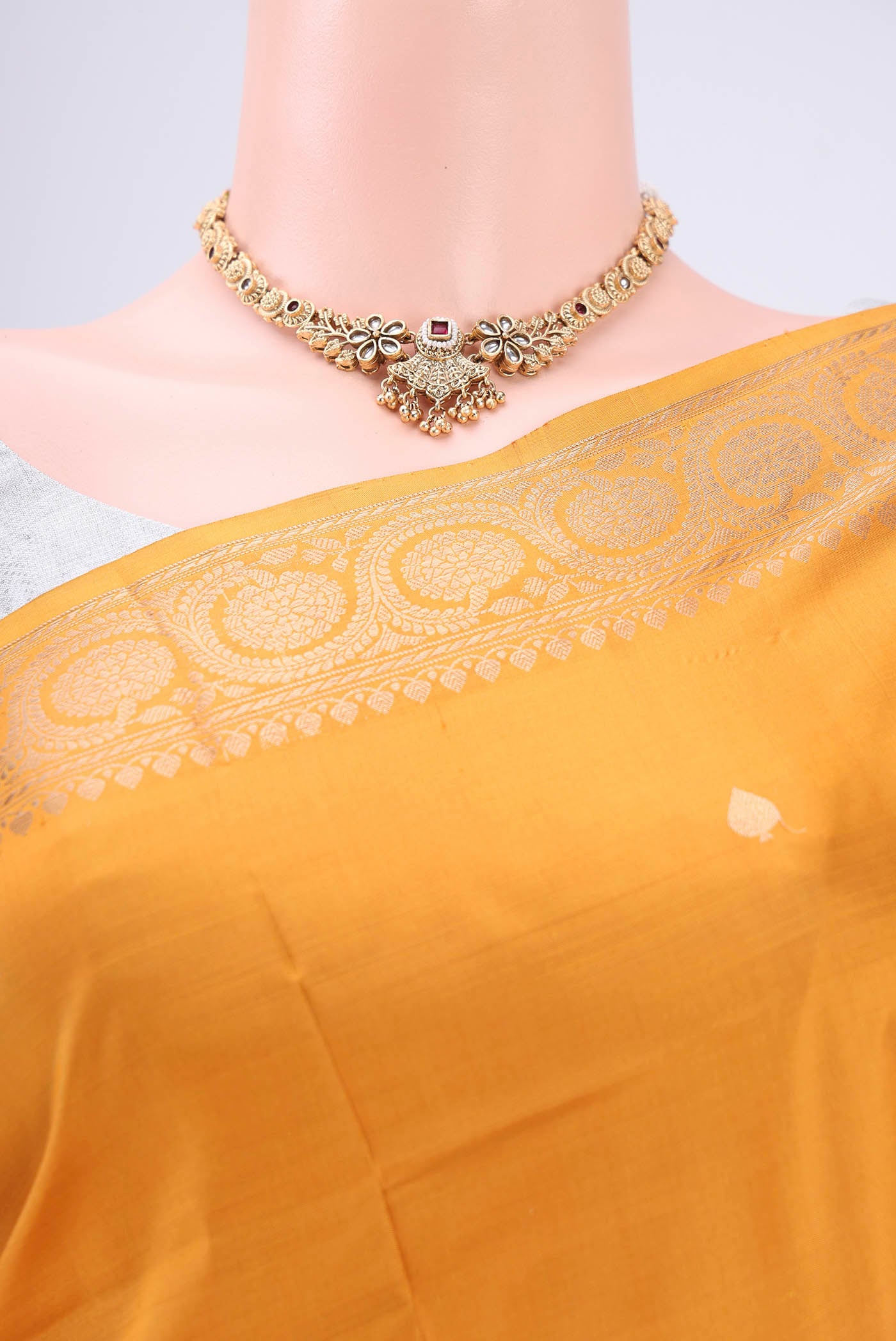 Border image of Yellow Soft Silk Saree with Zari Butta on the body and Zari Border. 