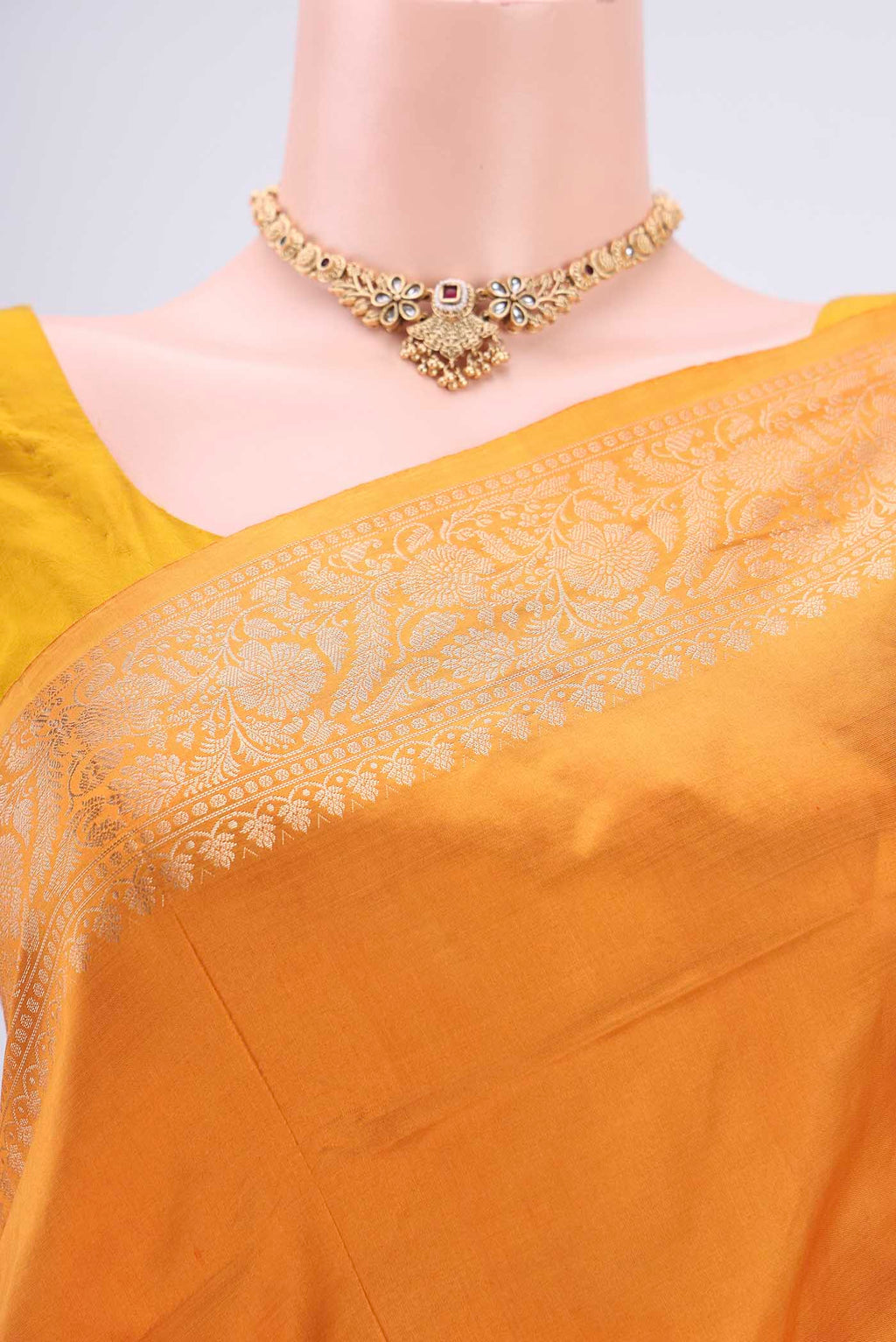 Border image of Orange Banarasi Katan Silk Saree with Zari Butta on the body and Zari Border. 