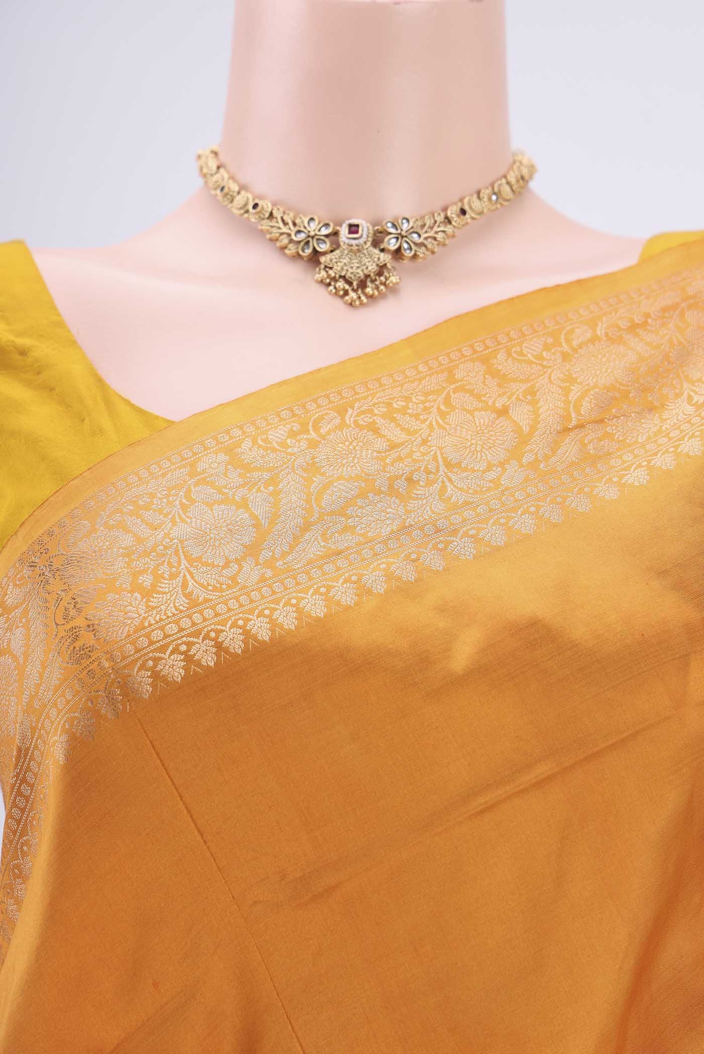 Border image of Orange Banarasi Katan Silk Saree with Zari Butta on the body and Zari Border. 