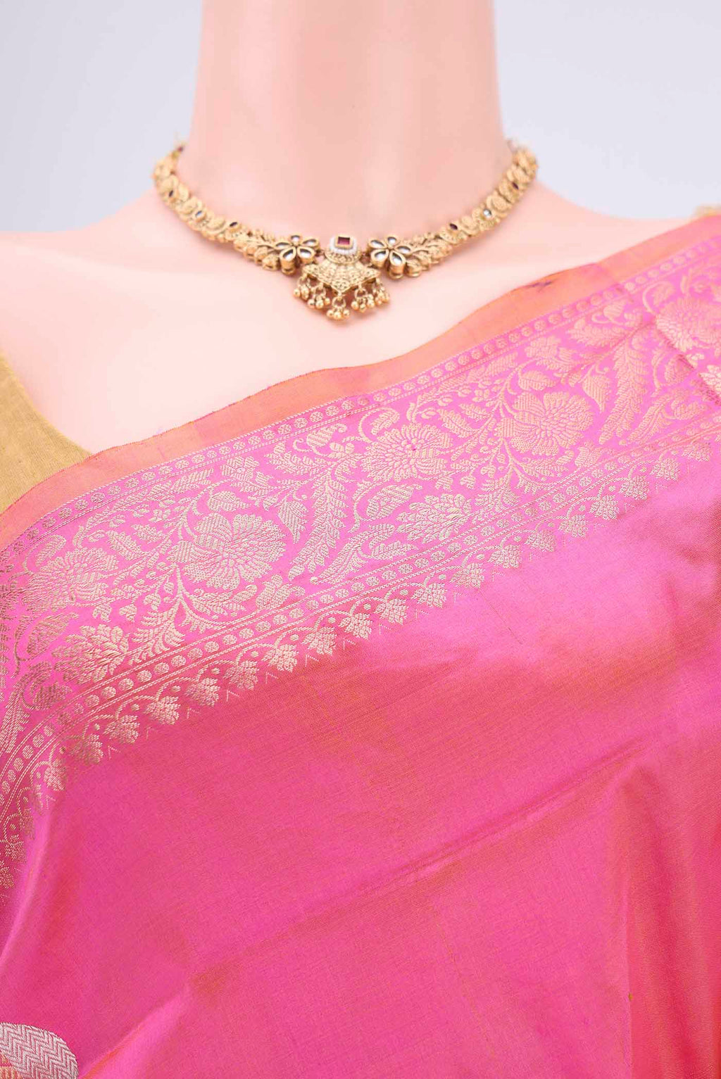 Border image of Pinkish Yellow Dual Tone Banarasi Katan Silk Saree with Zari Butta on the body and Zari Border. 