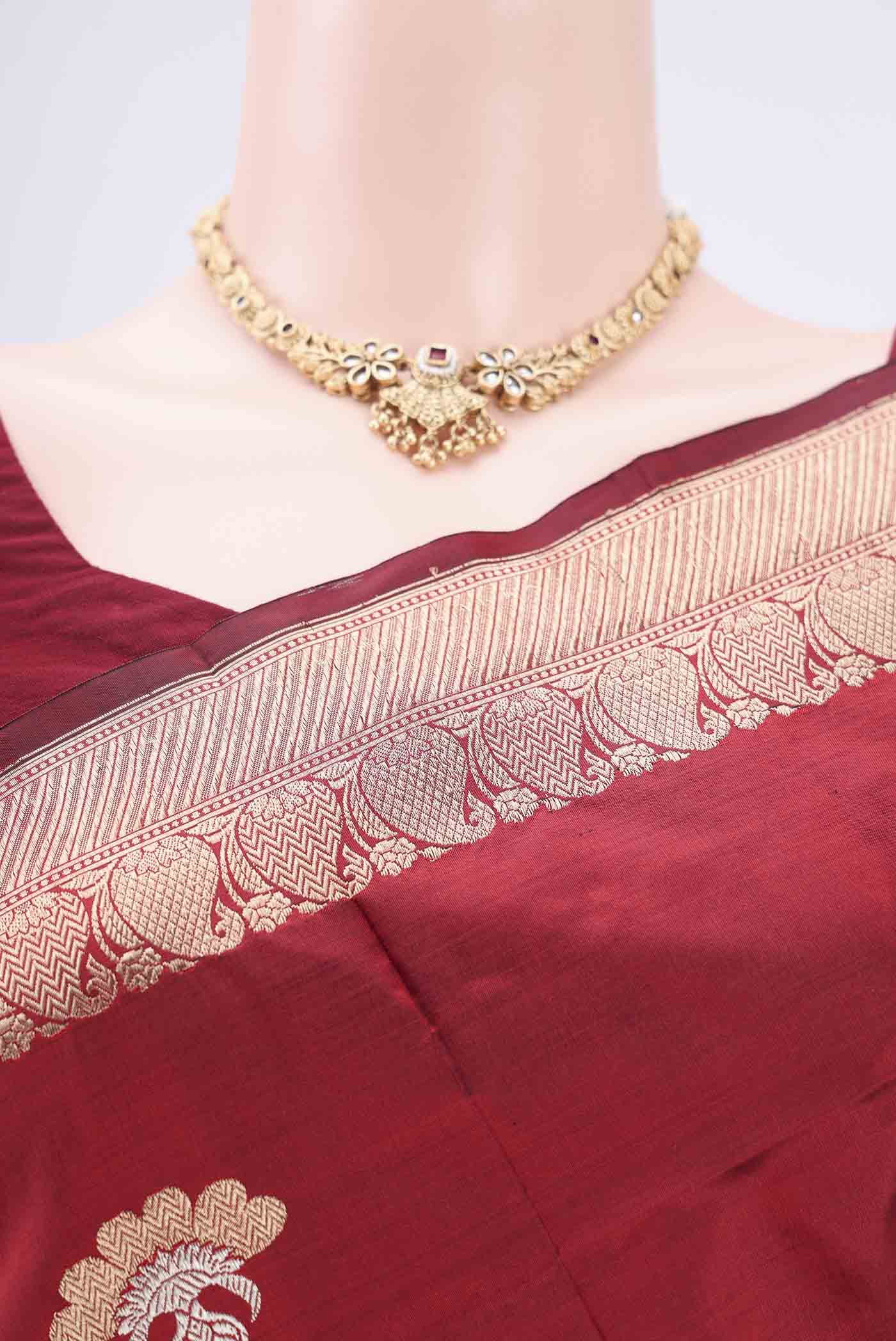 Border image of Maroon Banarasi Katan Silk Saree with Zari Butta on the body and Zari Border. 