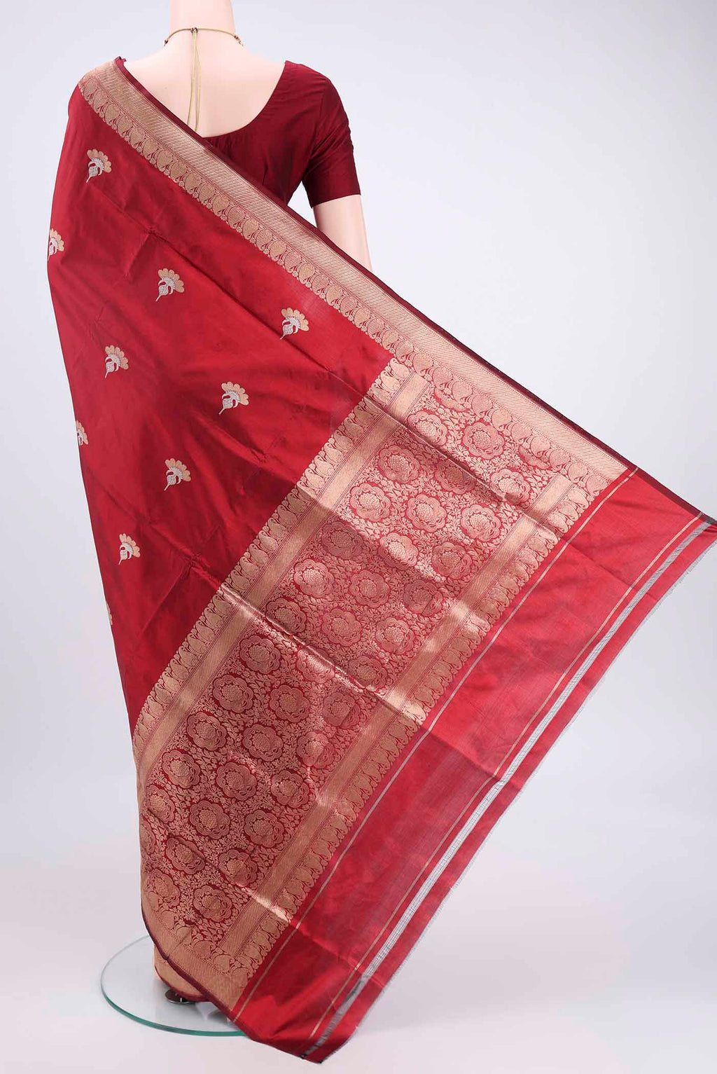 Flat view of Maroon Banarasi Katan Silk Saree with Zari Butta on the body and Zari Border. 