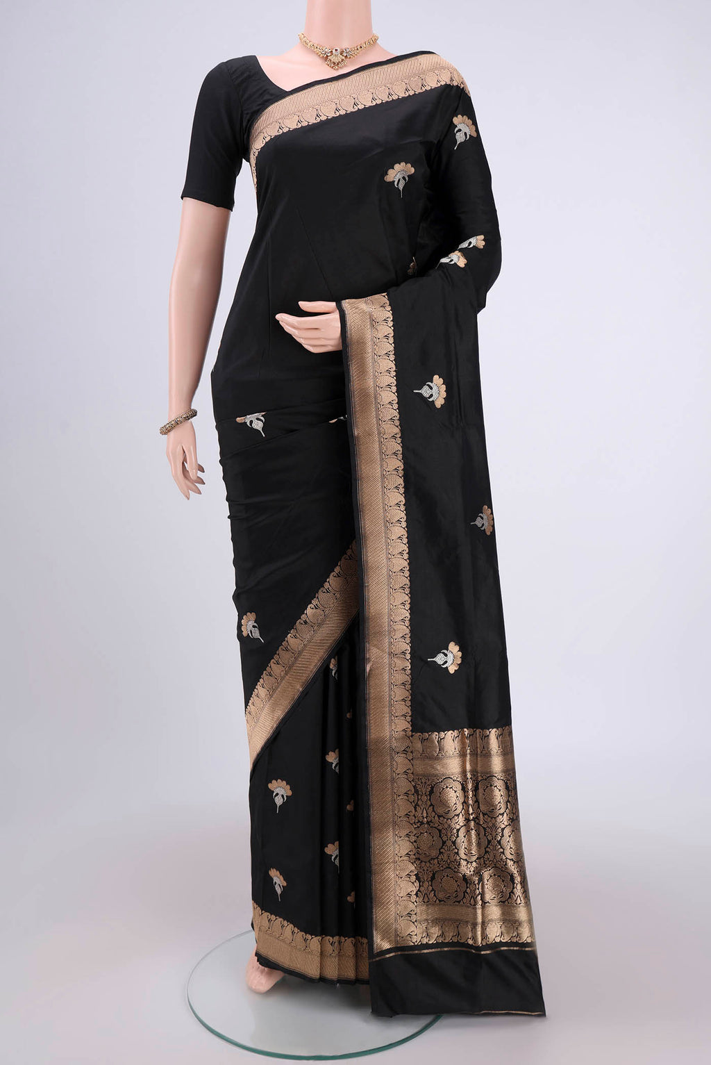 Black Banarasi Katan Silk Saree with Zari Butta on the body and Zari Border.  displayed on a mannequin
