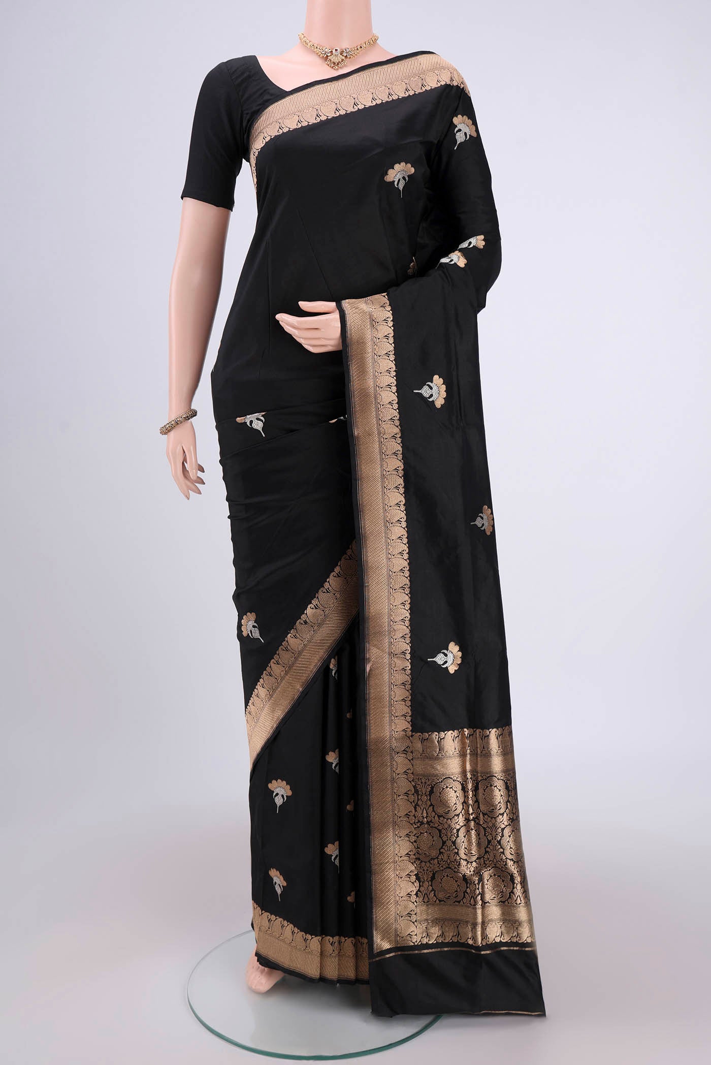 Black Banarasi Katan Silk Saree with Zari Butta on the body and Zari Border.  displayed on a mannequin