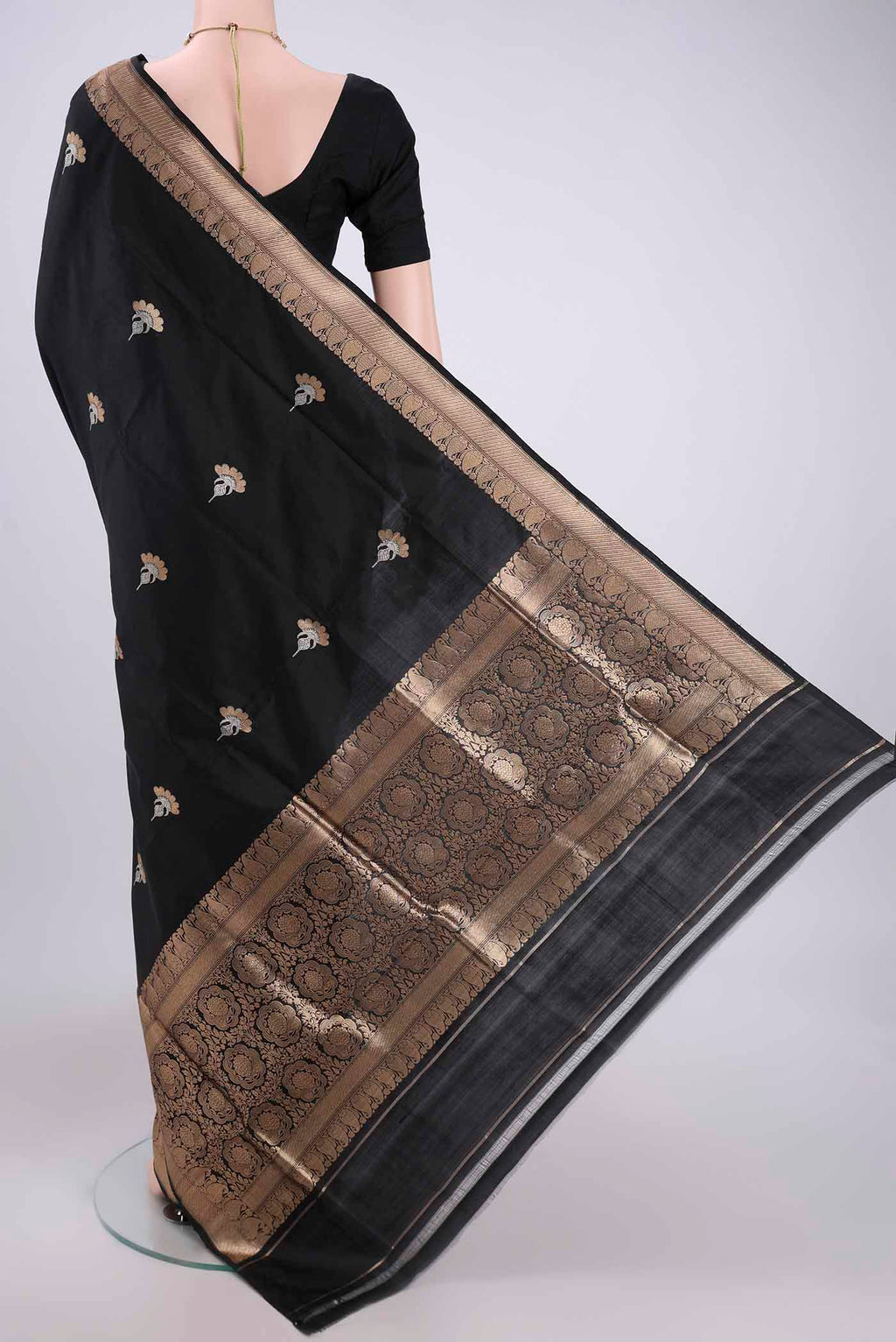 Flat view of Black Banarasi Katan Silk Saree with Zari Butta on the body and Zari Border. 