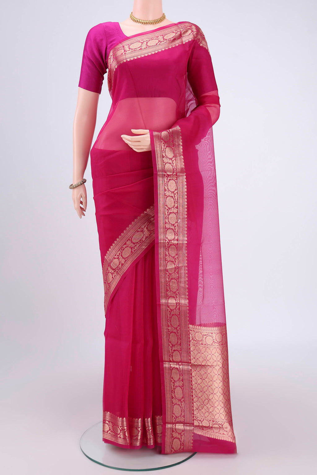 Pink Organza Silk Saree with Plain Body and Zari Border.  displayed on a mannequin