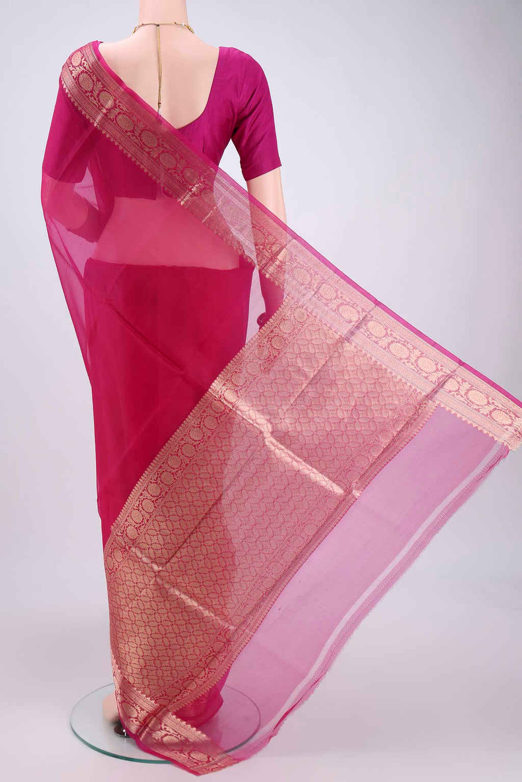 Flat view of Pink Organza Silk Saree with Plain Body and Zari Border. 