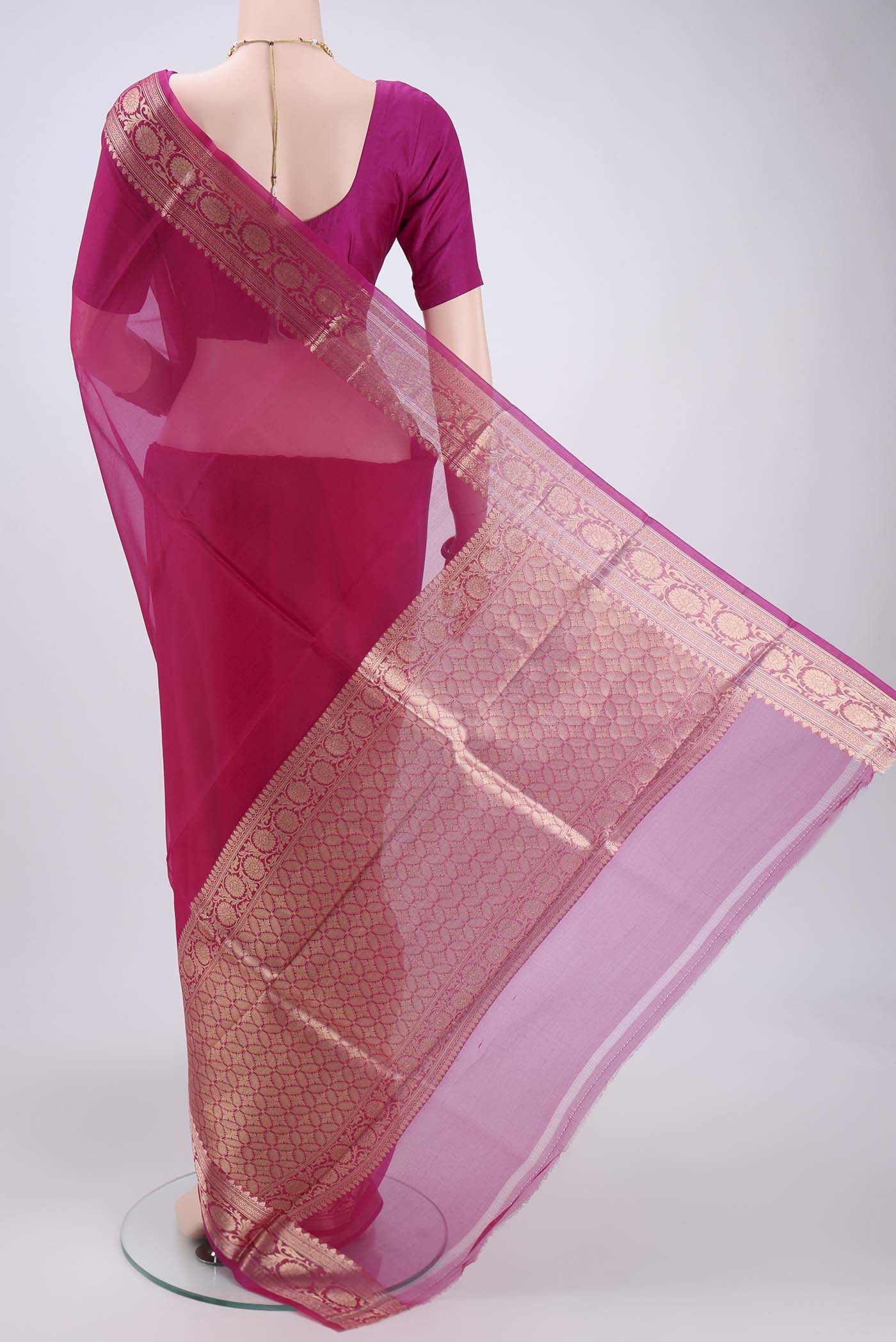Flat view of Pink Organza Silk Saree with Plain Body and Zari Border. 