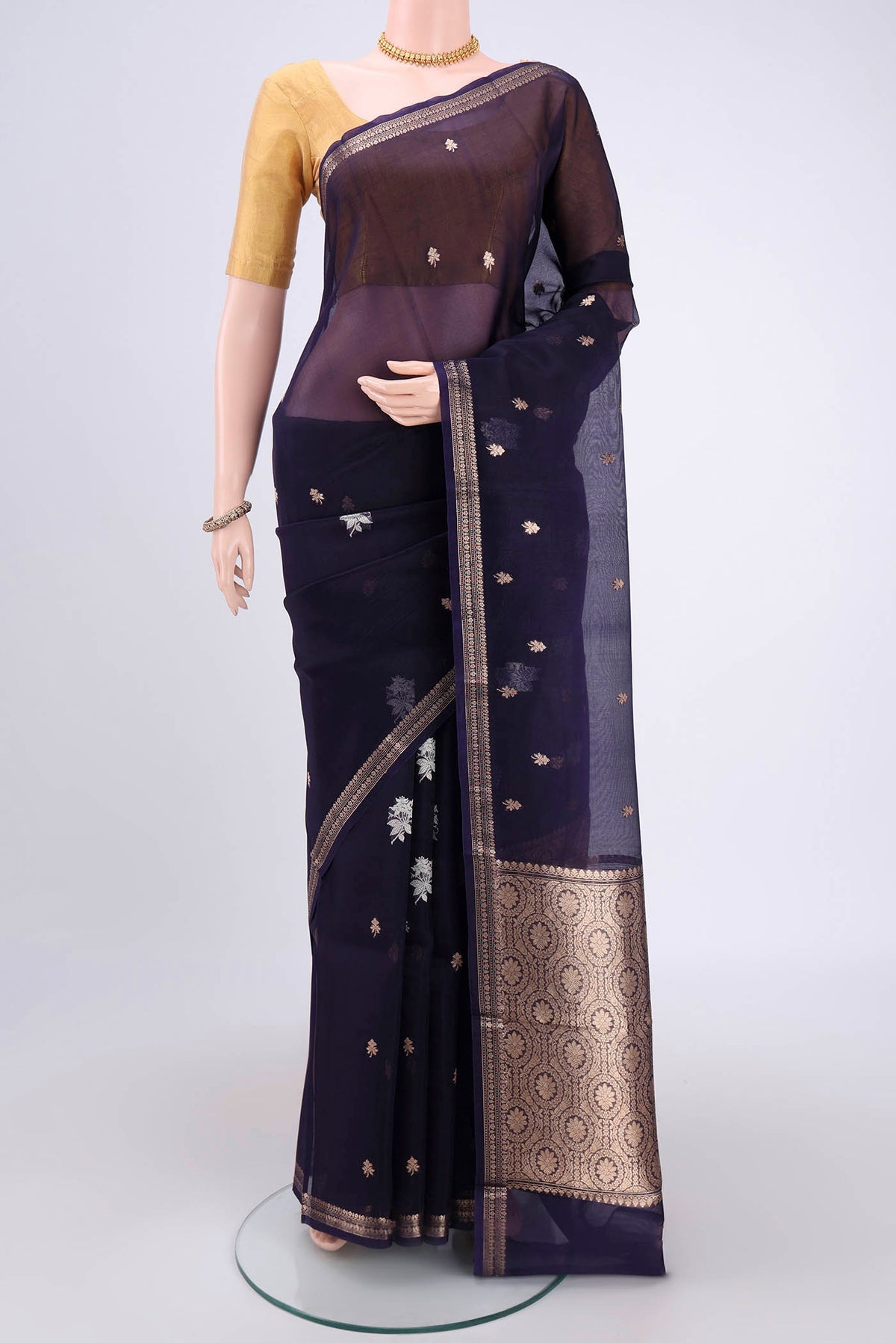 Purple Organza Silk Saree with Plain Body and Zari Border.  displayed on a mannequin