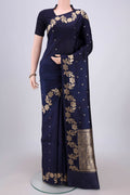 Navy Blue Banarasi Katan Silk Saree with Zari Butta on the body and Zari Border.  displayed on a mannequin