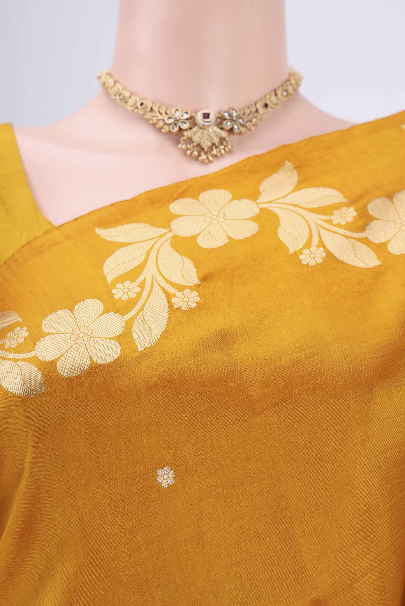 Border image of Mustard Banarasi Katan Silk Saree with Zari Butta on the body and Zari Border. 