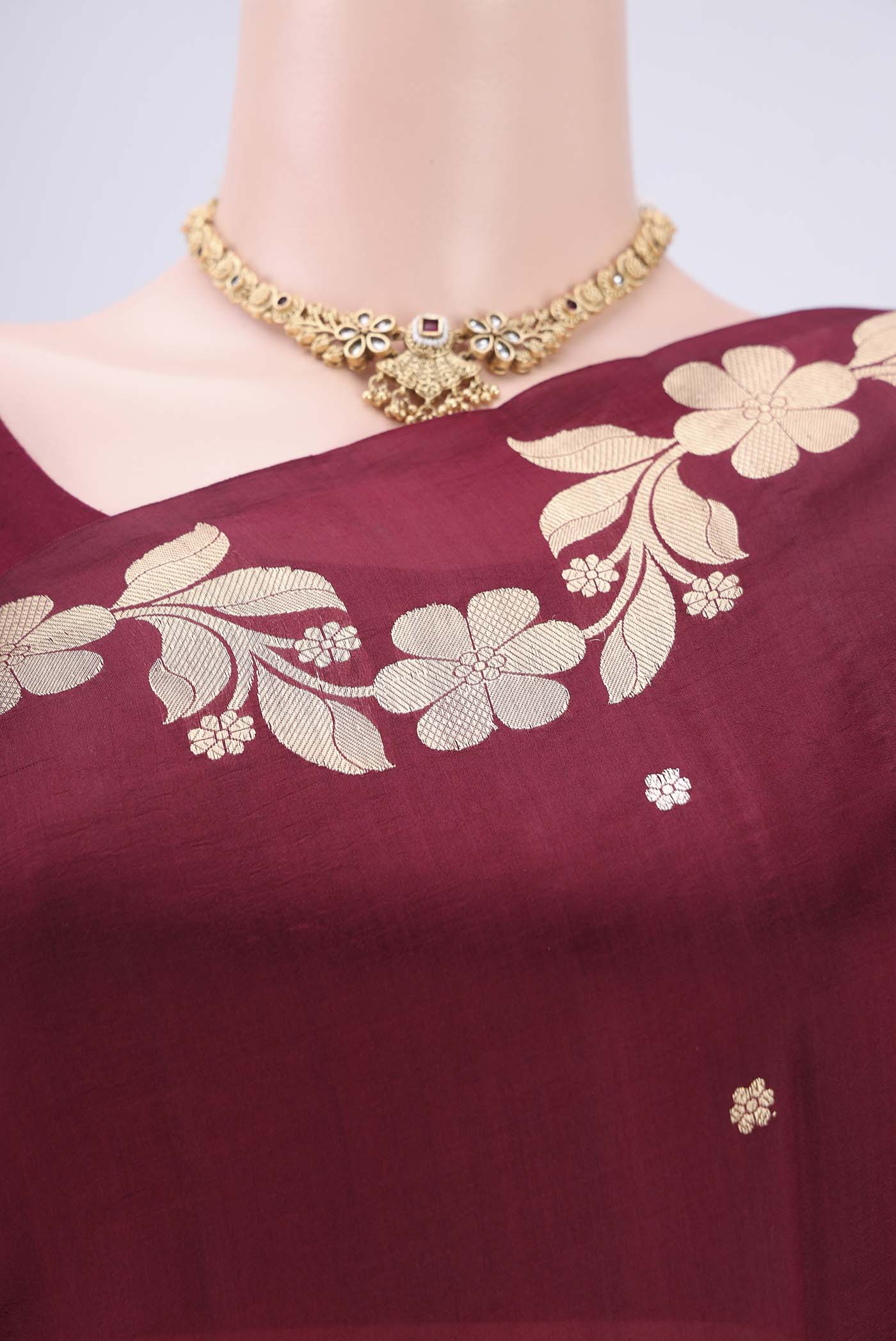 Border image of Maroon Banarasi Katan Silk Saree with Zari Butta on the body and Zari Border. 