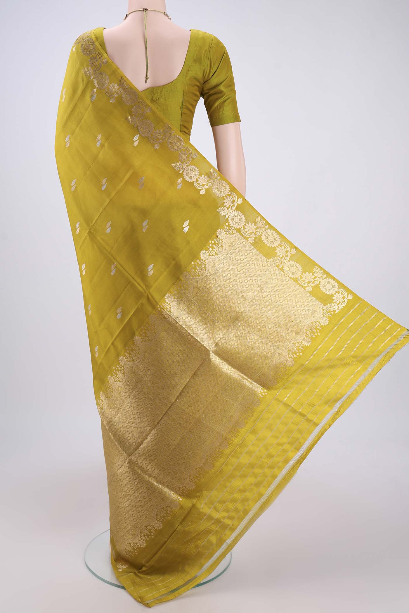 Flat view of Mehandi Green Banarasi Katan Silk Saree with Zari Butta on the body and Zari Border. 