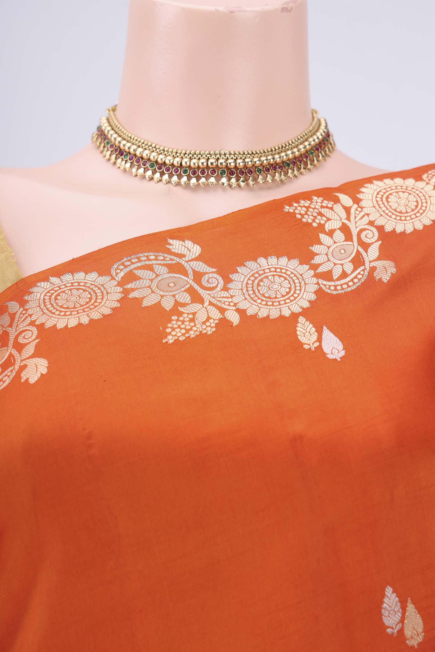 Border image of Rust Banarasi Katan Silk Saree with Zari Butta on the body and Zari Border. 