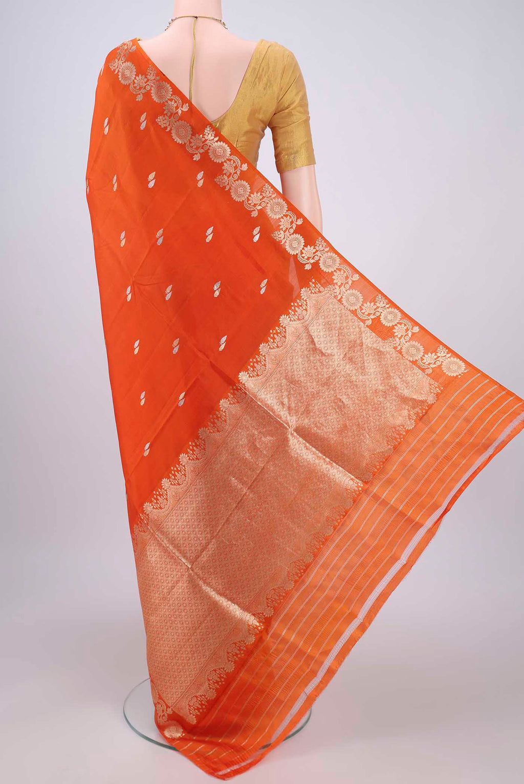 Flat view of Rust Banarasi Katan Silk Saree with Zari Butta on the body and Zari Border. 