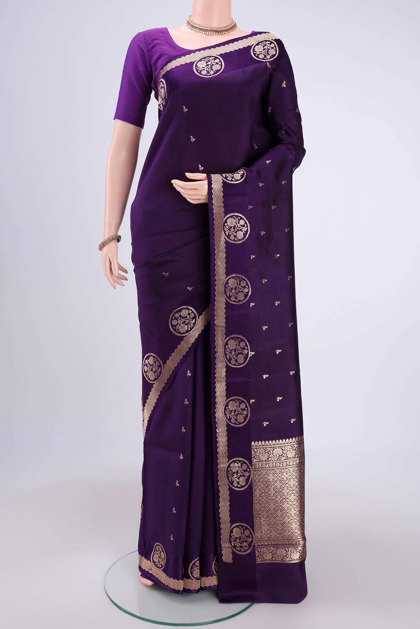 Purple Banarasi Katan Silk Saree with Zari Butta on the body and Zari Border.  displayed on a mannequin