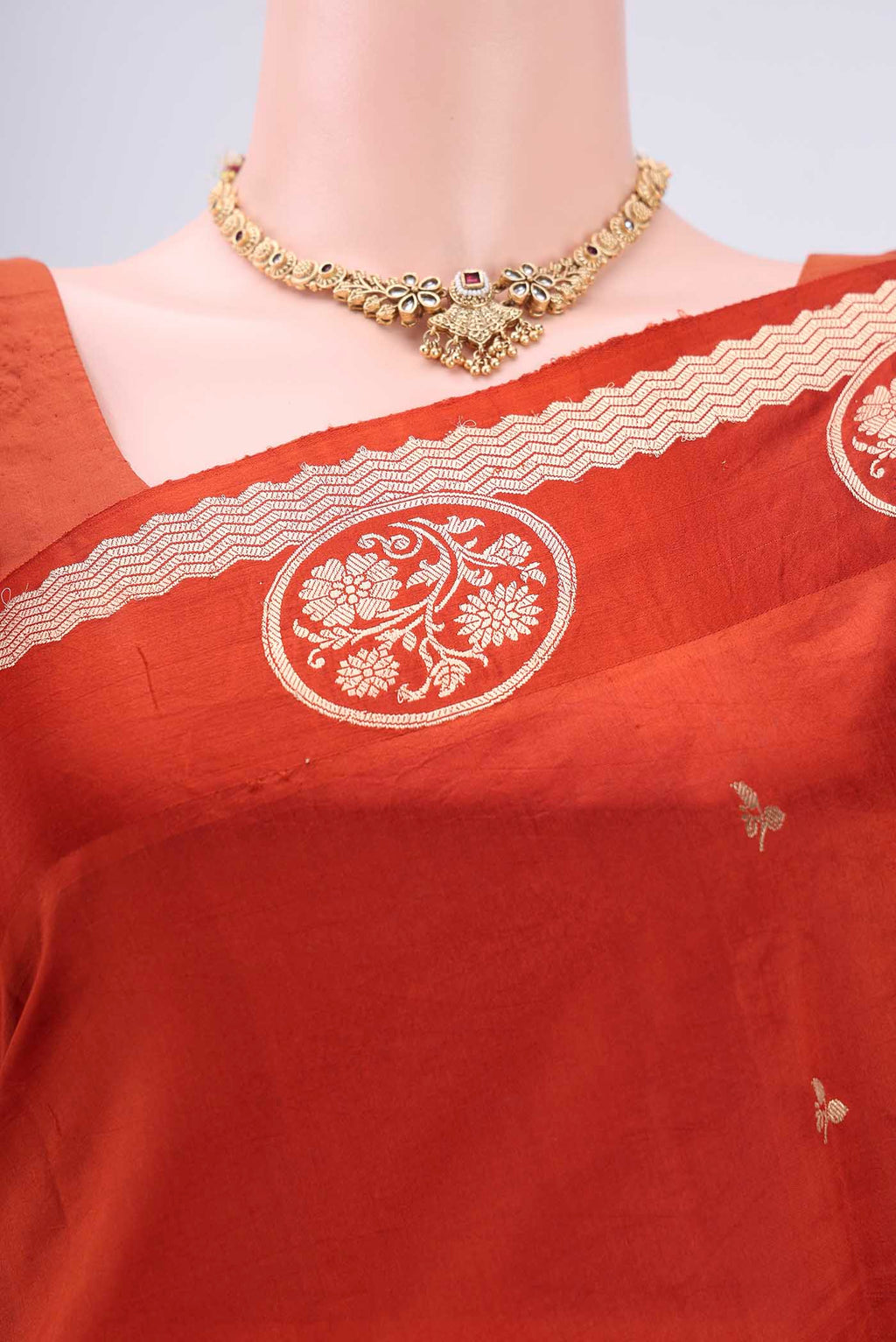 Border image of Rust Banarasi Katan Silk Saree with Zari Butta on the body and Zari Border. 