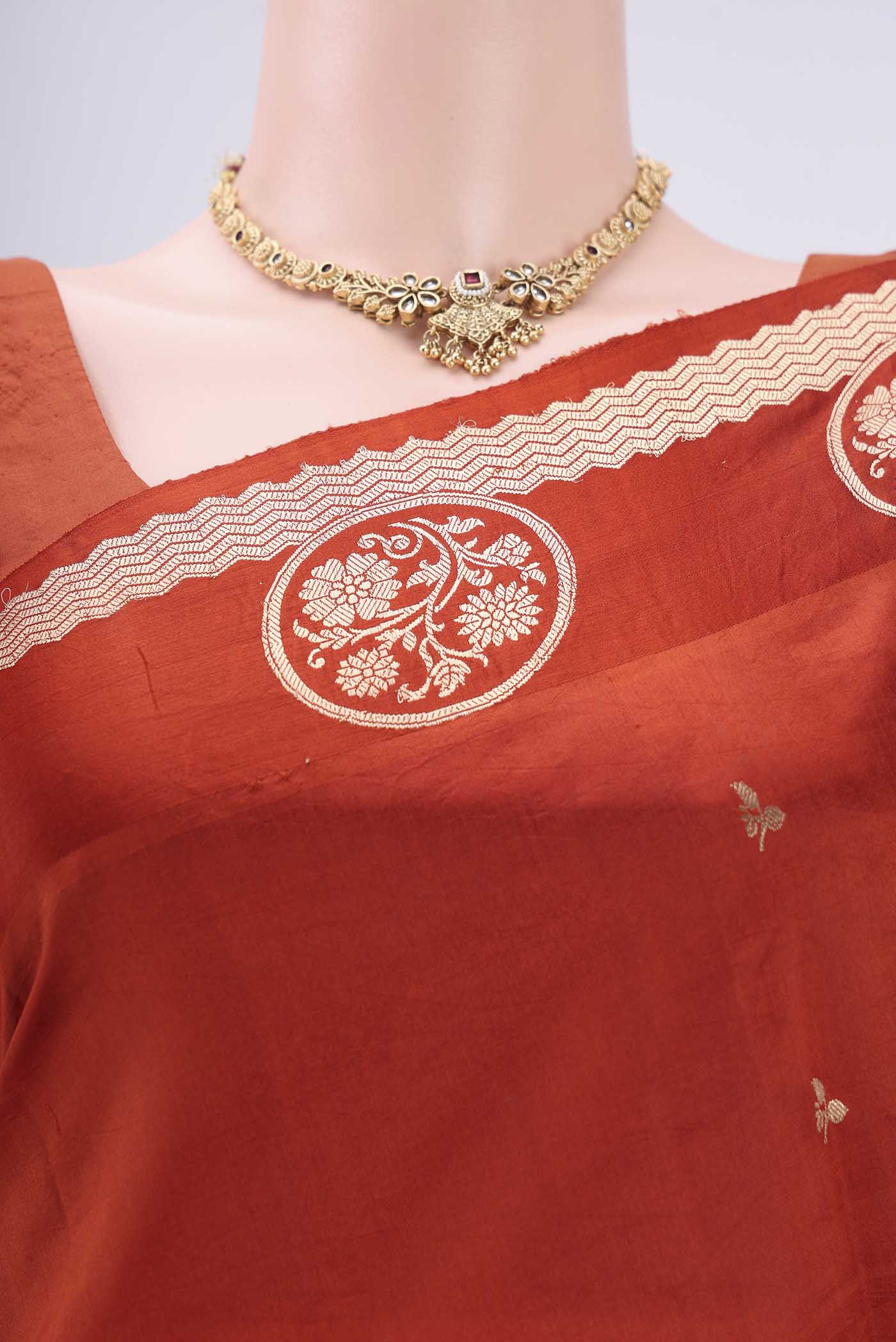 Border image of Rust Banarasi Katan Silk Saree with Zari Butta on the body and Zari Border. 