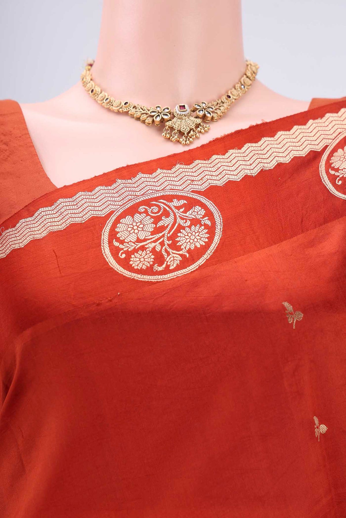 Border image of Rust Banarasi Katan Silk Saree with Zari Butta on the body and Zari Border. 