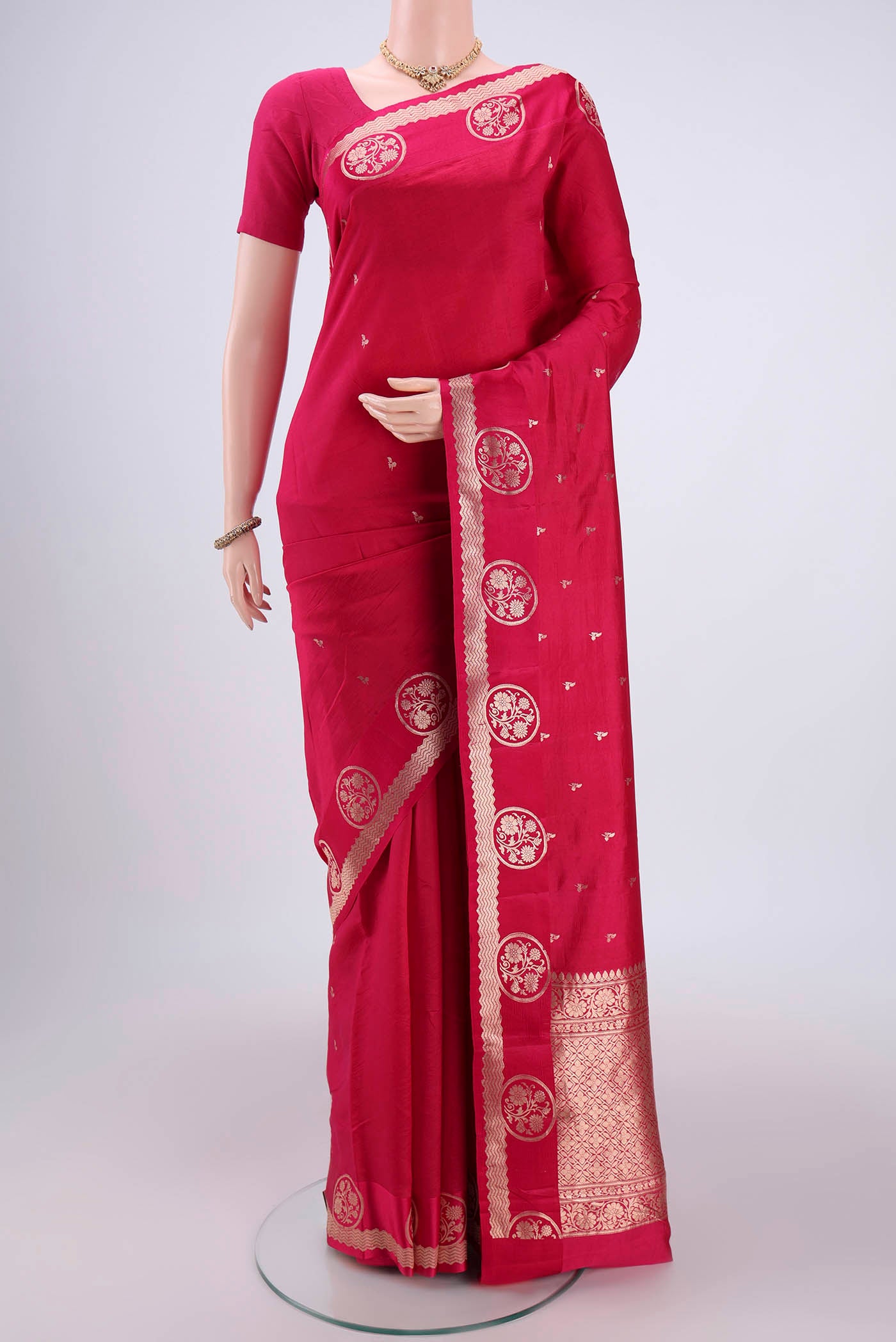 Pink Banarasi Katan Silk Saree with Zari Butta on the body and Zari Border.  displayed on a mannequin