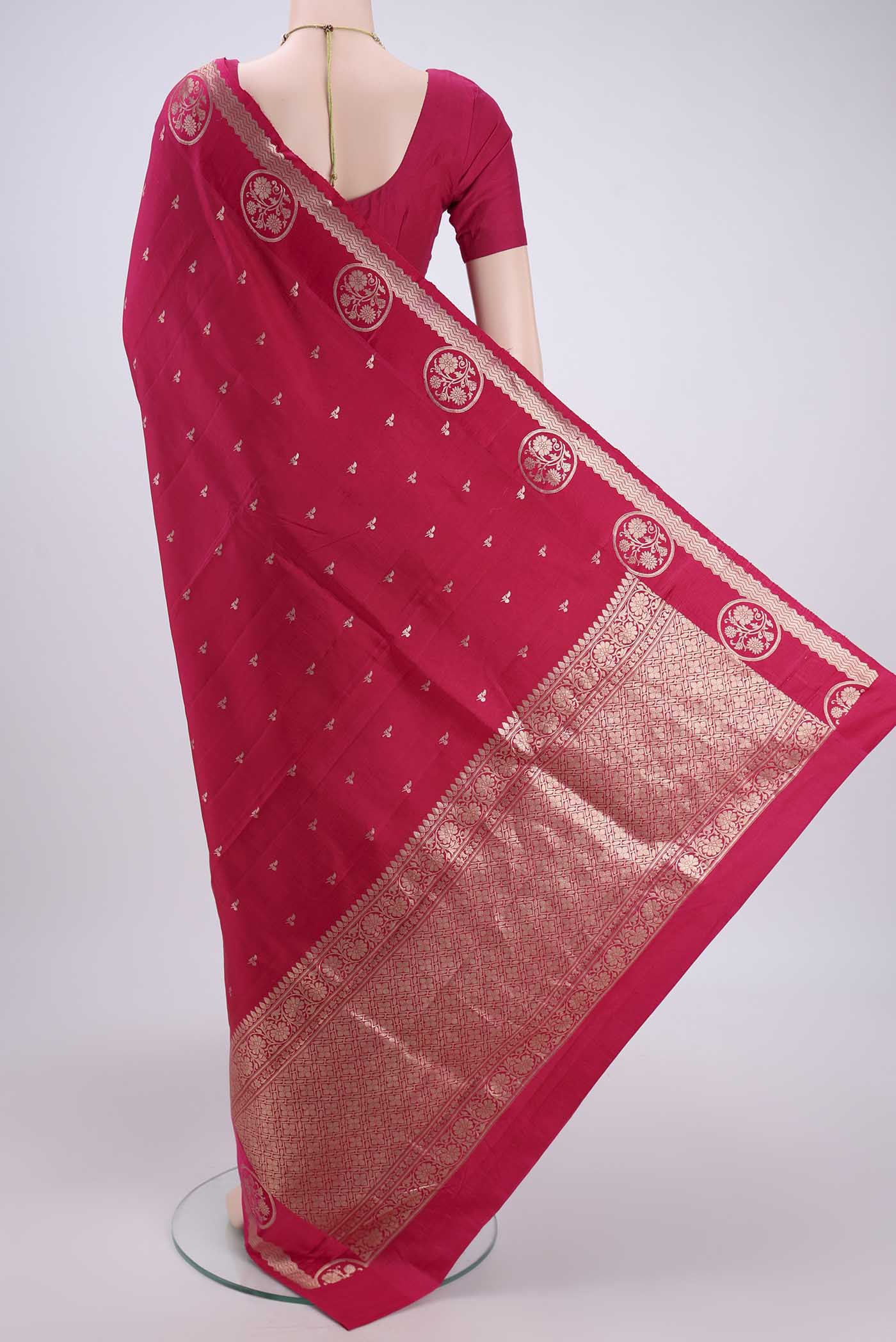 Flat view of Pink Banarasi Katan Silk Saree with Zari Butta on the body and Zari Border. 