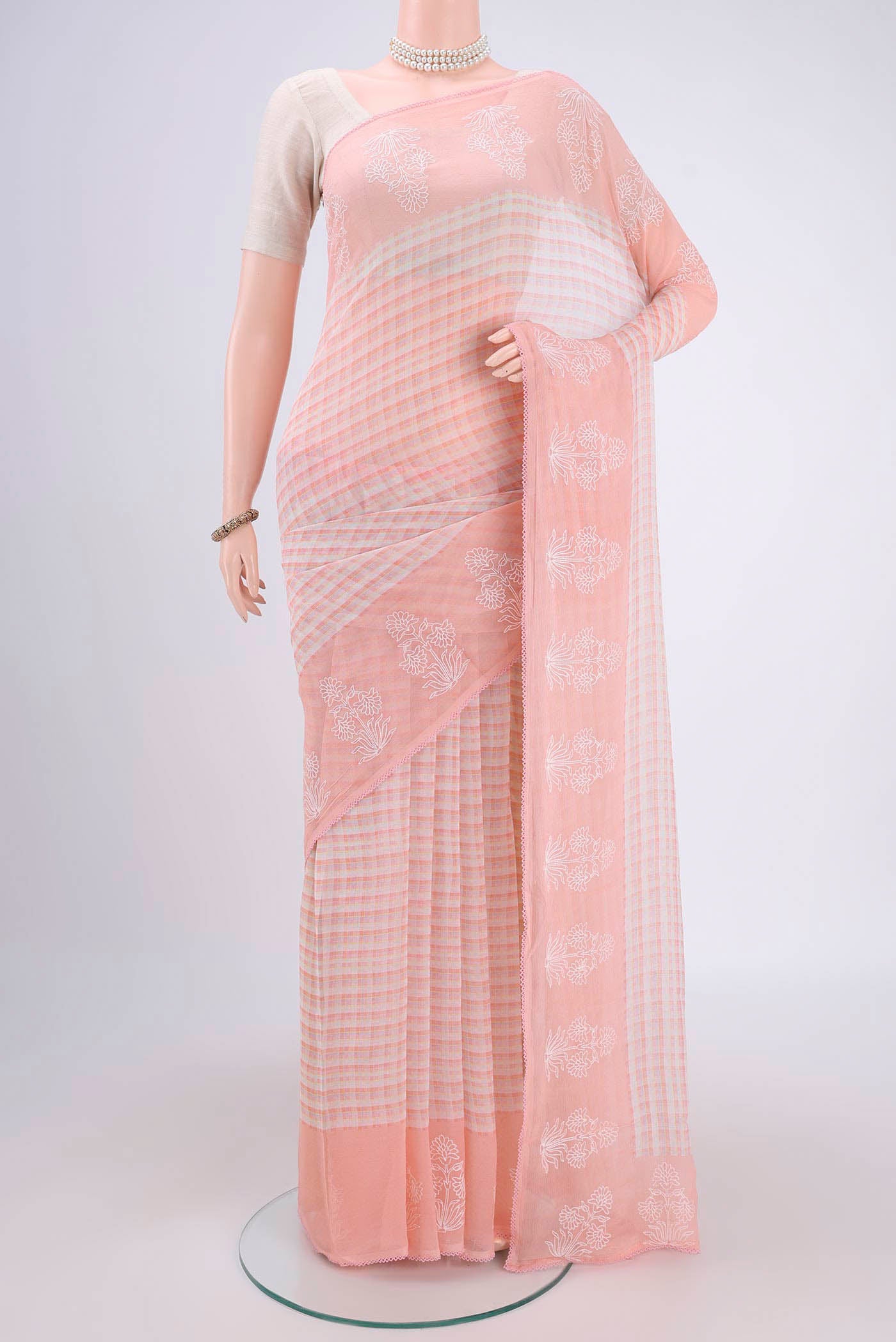 Beige Mysore Chiffon Saree with Checked design on the body and Thread Border.  displayed on a mannequin