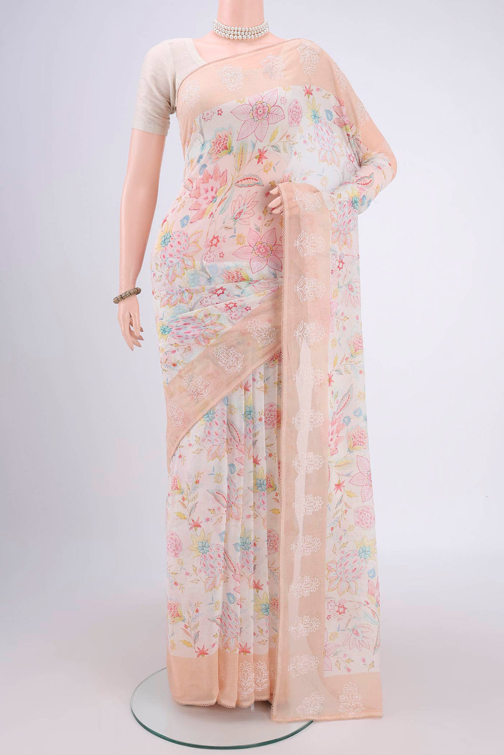 Off White Mysore Chiffon Saree with Checked design on the body and Thread Border.  displayed on a mannequin