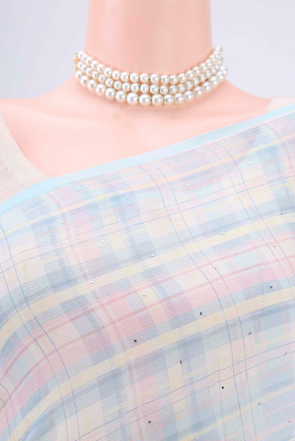 Border image of Sky Blue Mysore Chiffon Saree with Checked design on the body and Without Border. 