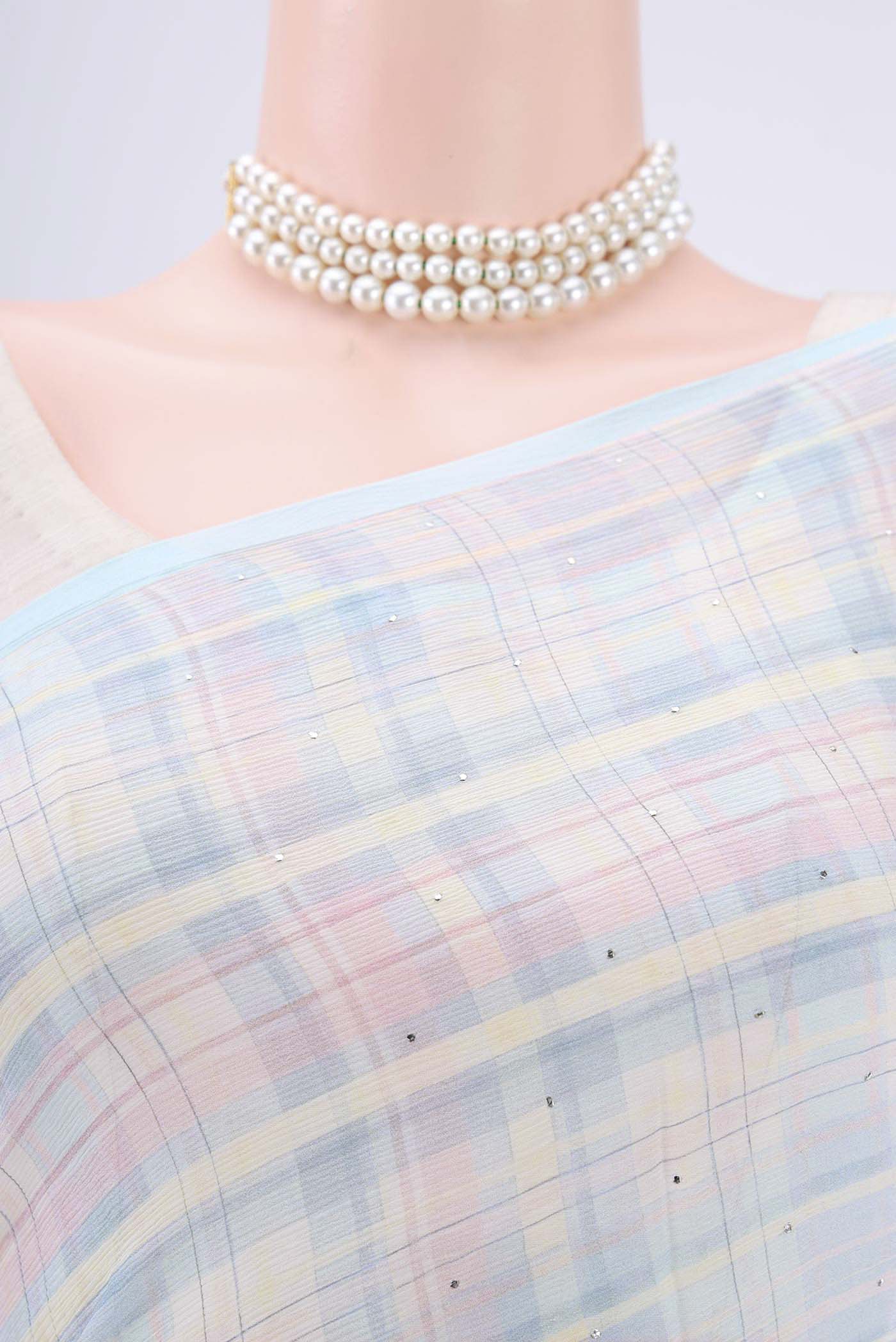 Border image of Sky Blue Mysore Chiffon Saree with Checked design on the body and Without Border. 