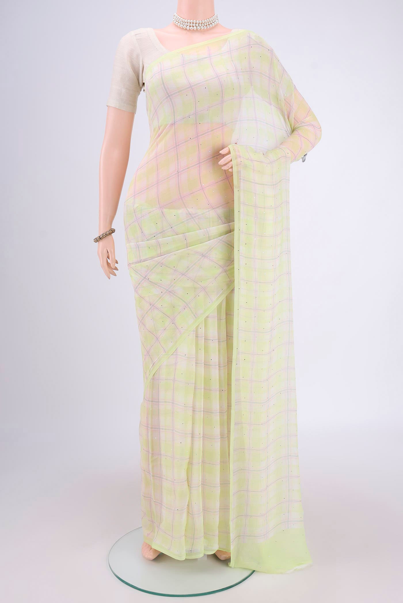 Light Green Mysore Chiffon Saree with Checked design on the body and Without Border.  displayed on a mannequin