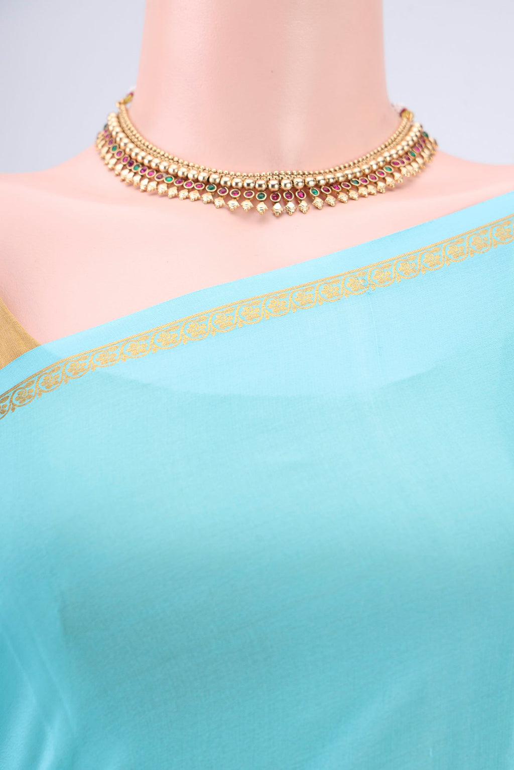 Border image of Sky Blue Mysore Crepe Saree with Plain Body and Zari Border. 