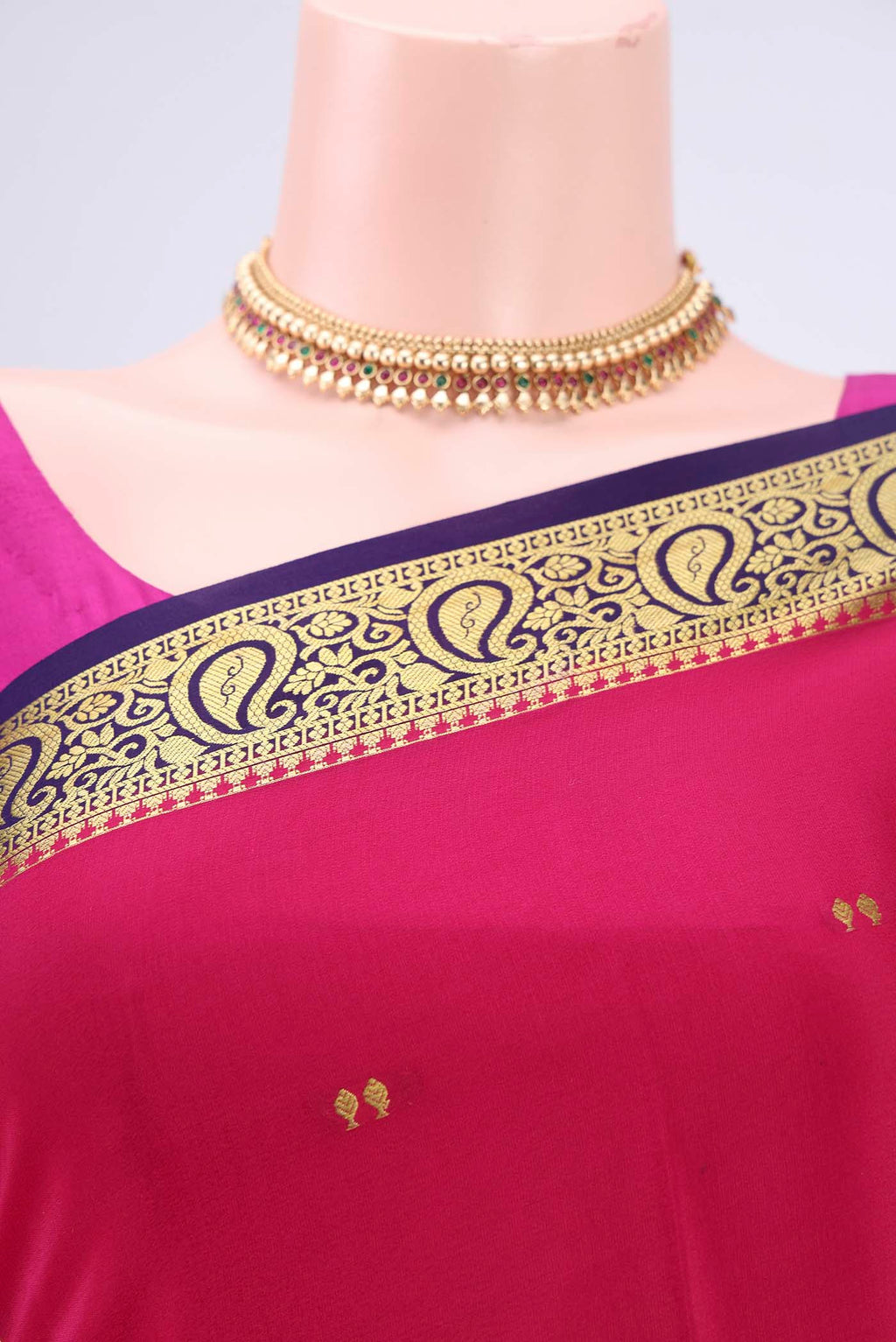 Border image of Rani Pink Mysore Crepe Saree with Plain Body and Zari Border. 