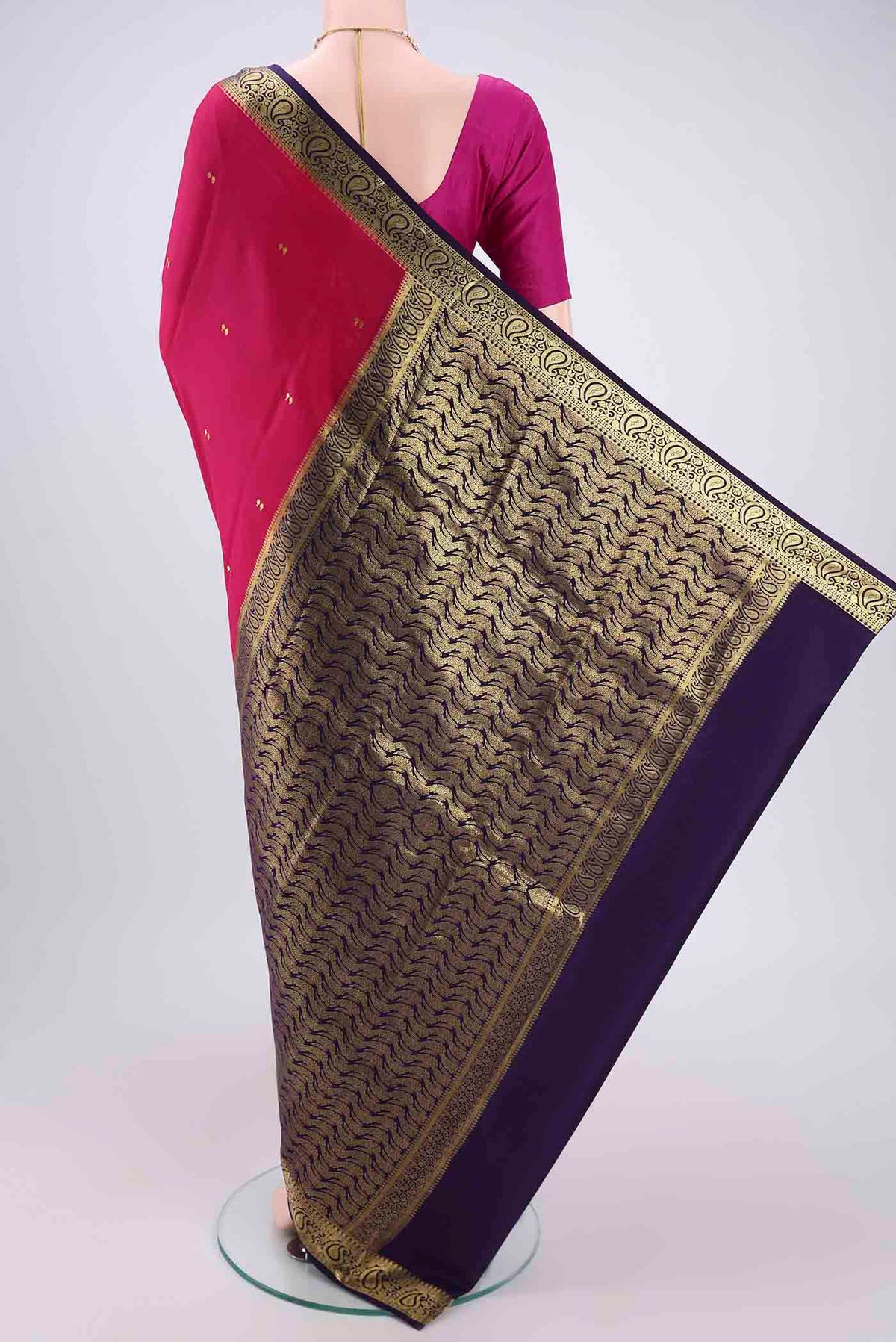 Flat view of Rani Pink Mysore Crepe Saree with Plain Body and Zari Border. 