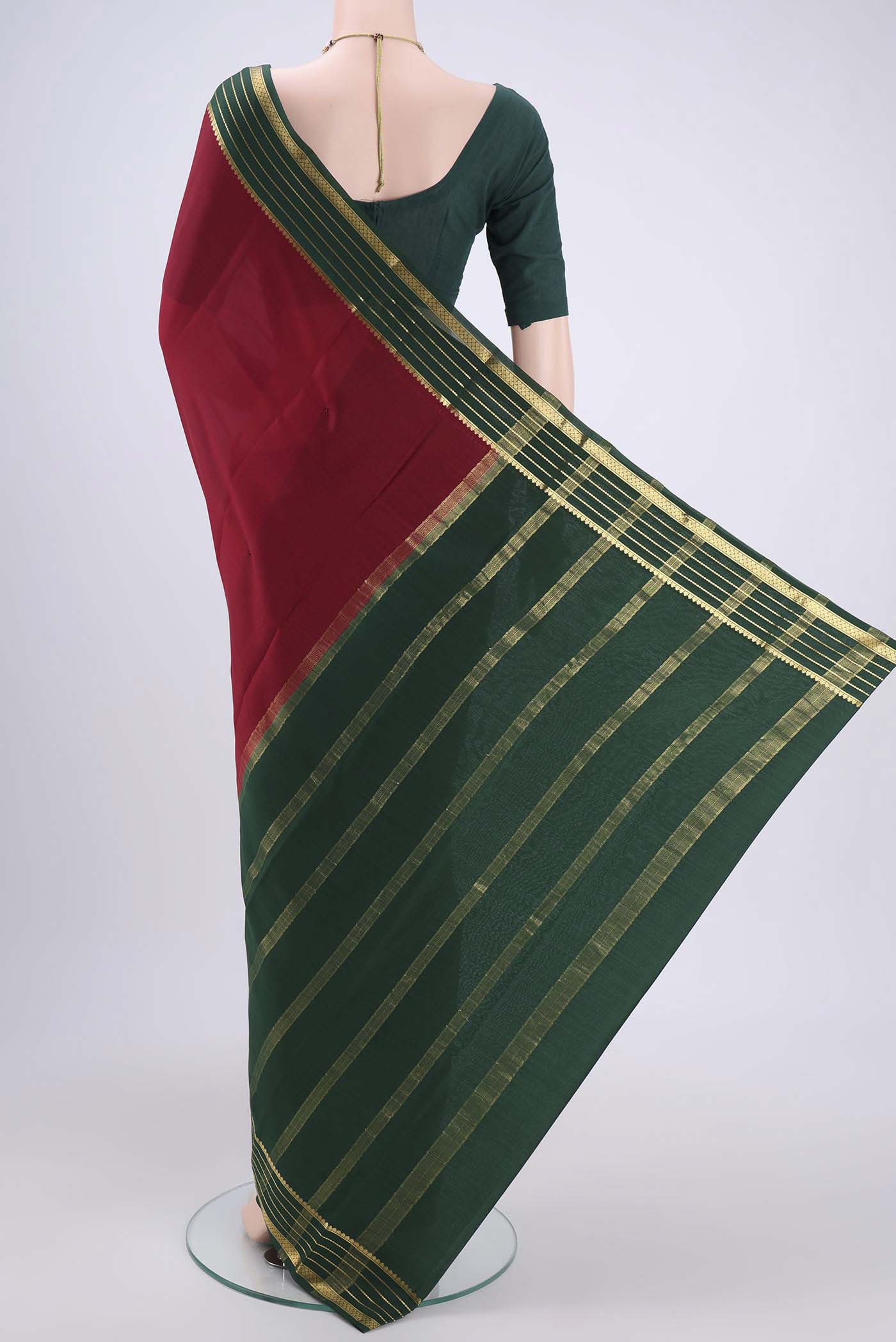 Flat view of Red Mysore Crepe Saree with Plain Body and Zari Border. 