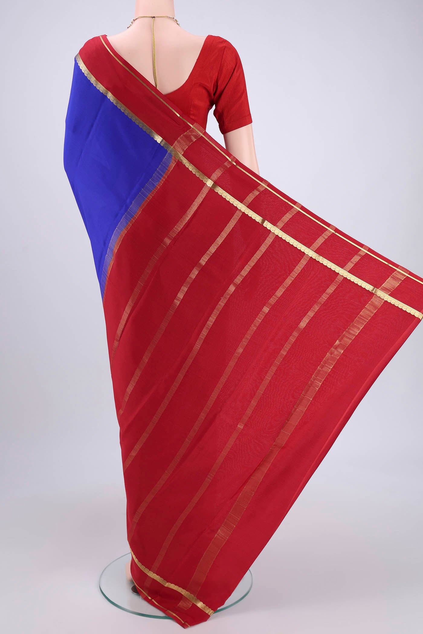 Flat view of Royal Blue Mysore Crepe Saree with Plain Body and Zari Border. 