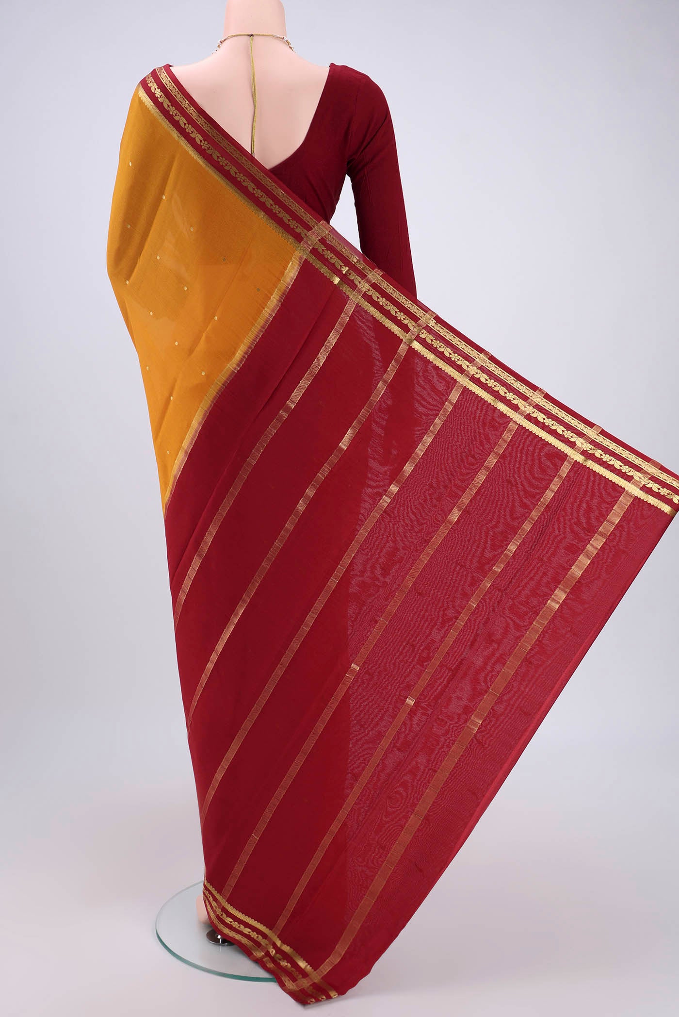 Flat view of Yellow Mysore Crepe Saree with Plain Body and Zari Border. 