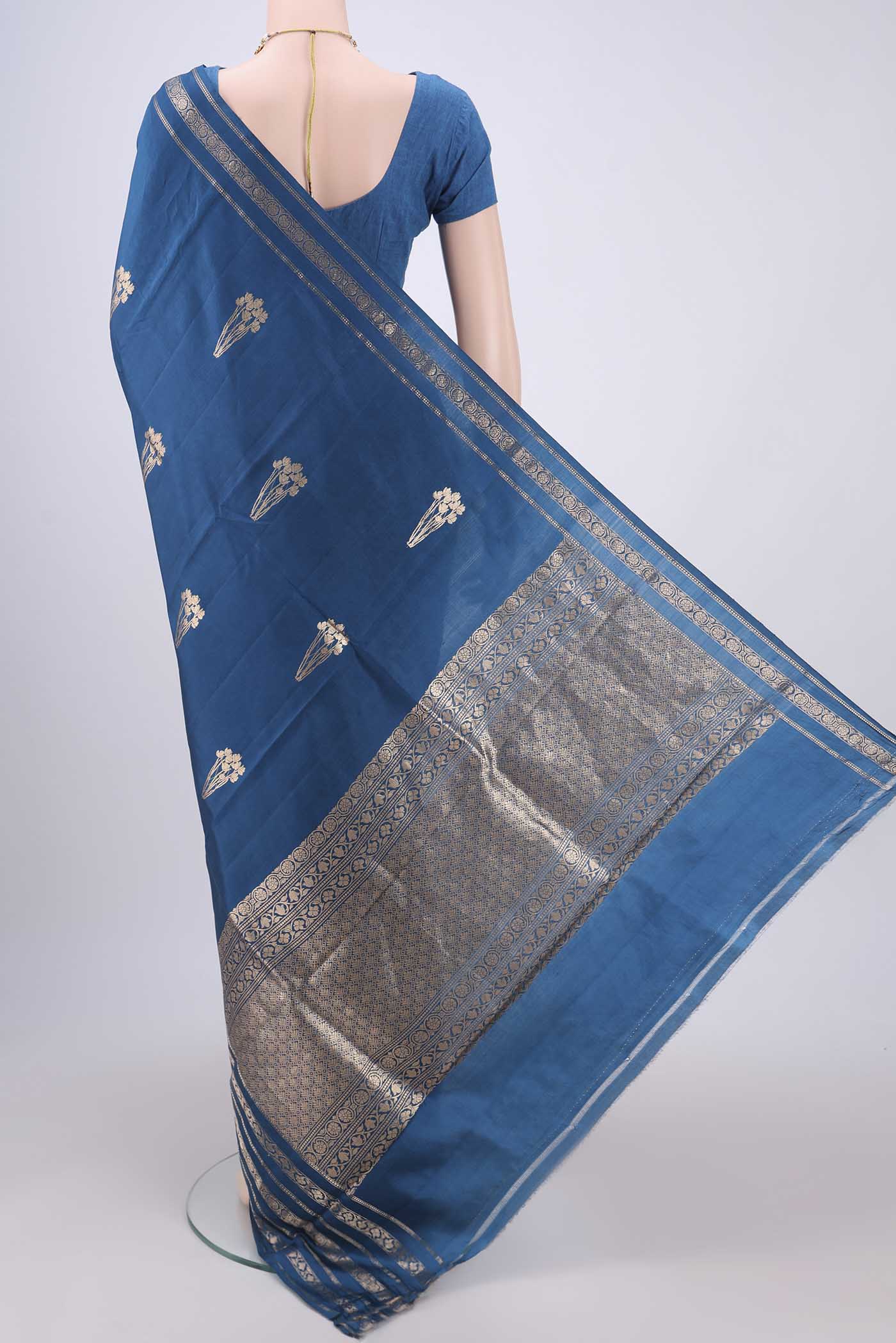 Flat view of Blue Banarasi Katan Silk Saree with Zari Butta on the body and Zari Border. 