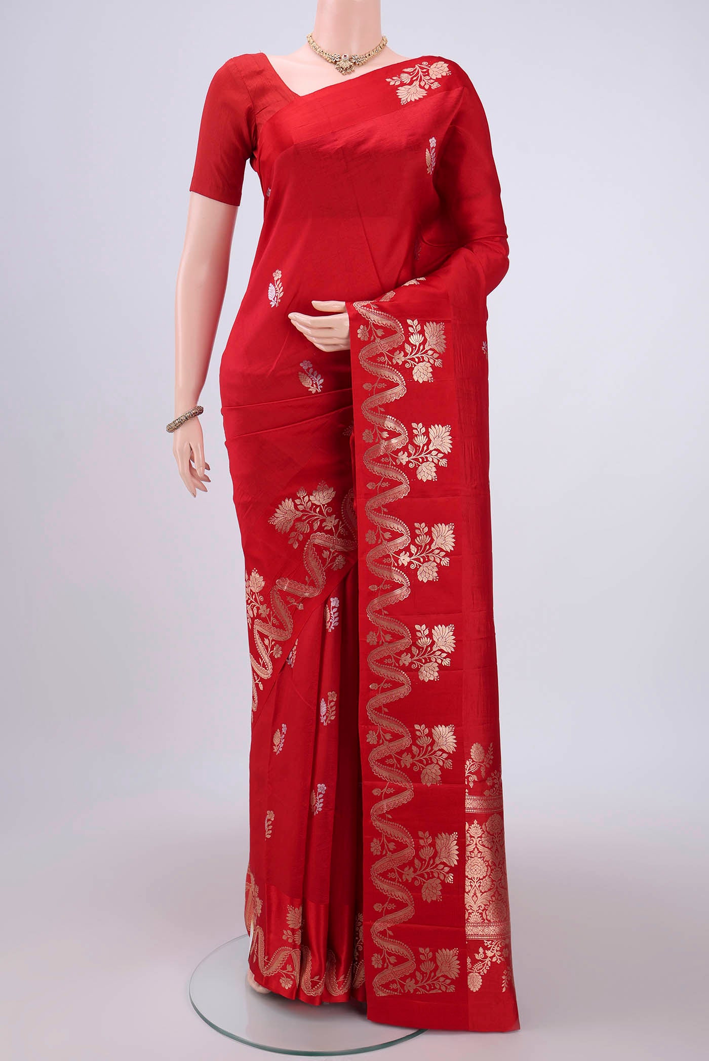 Red Banarasi Katan Silk Saree with Zari Butta on the body and Zari Border.  displayed on a mannequin