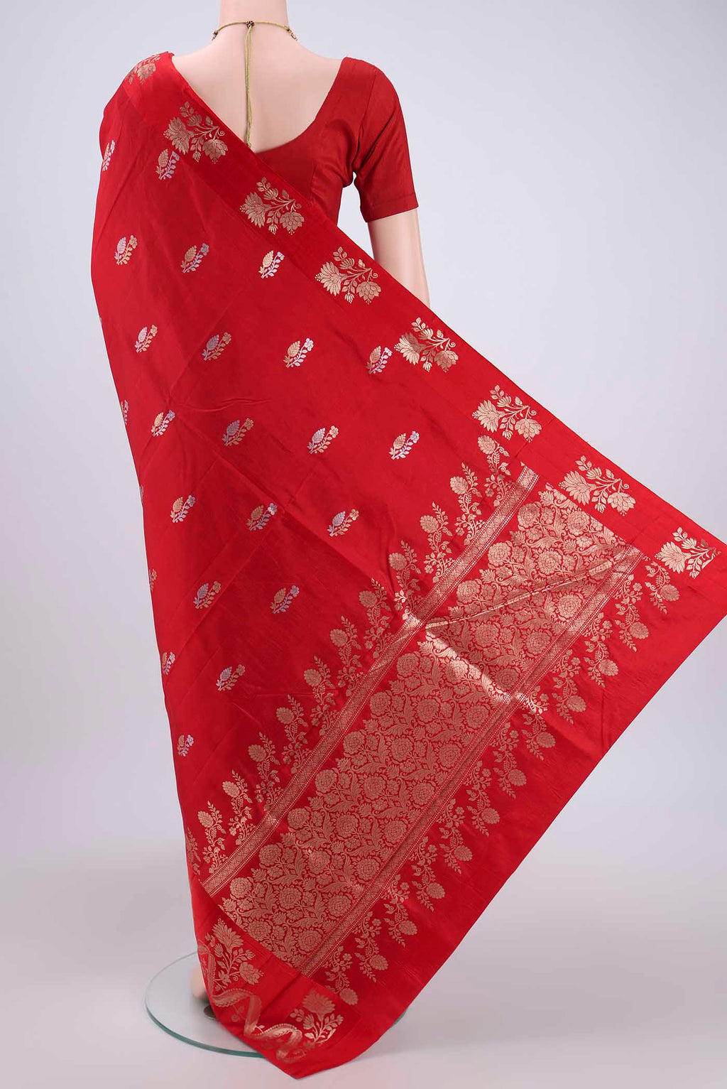 Flat view of Red Banarasi Katan Silk Saree with Zari Butta on the body and Zari Border. 