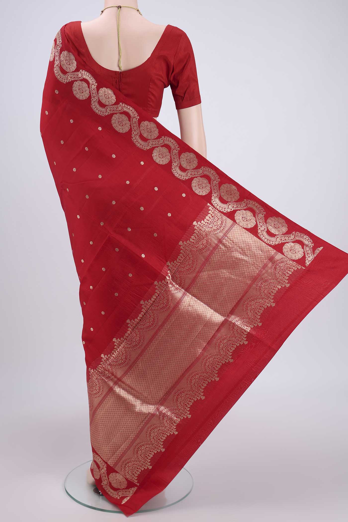 Flat view of Red Banarasi Katan Silk Saree with Zari Butta on the body and Zari Border. 